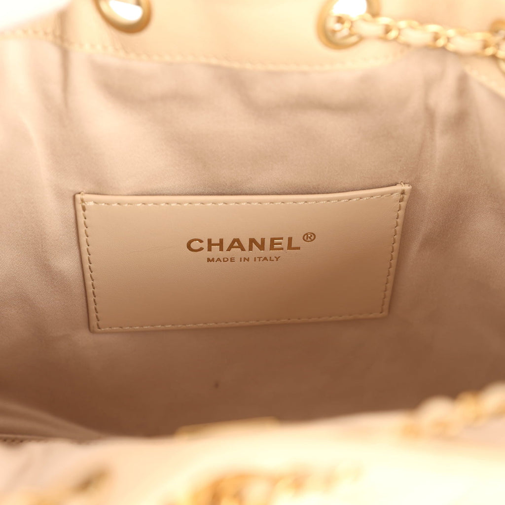 pre-owned-chanel-small-25-hobo-bag-beige-caviar-antique-gold-metal