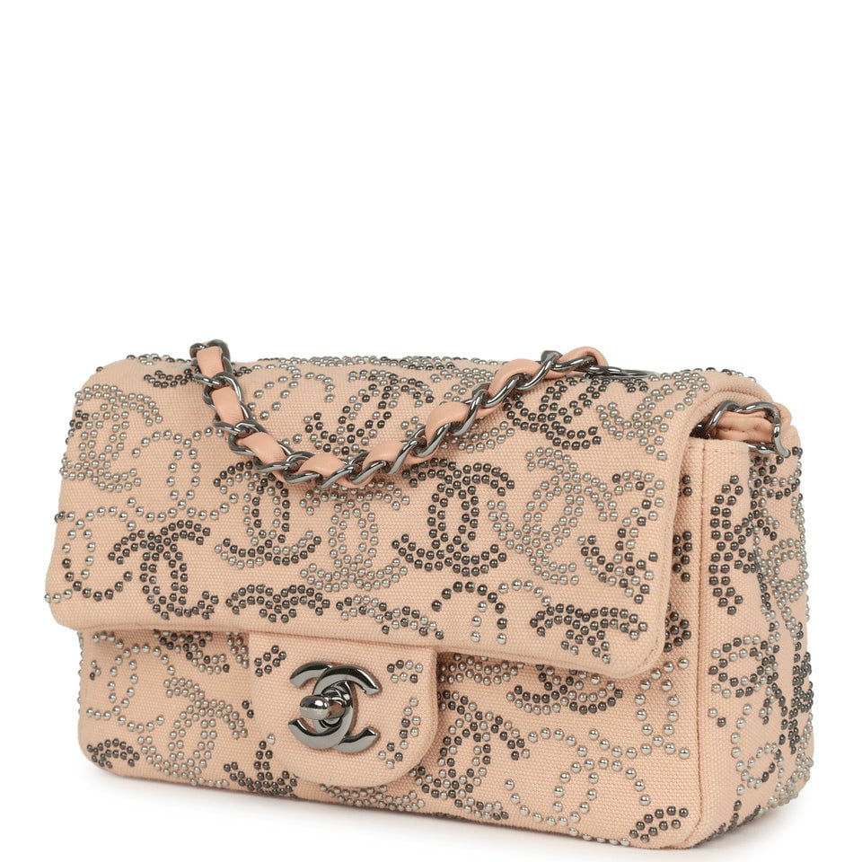 pre-owned-chanel-mini-cc-studded-rectangular-flap-bag-light-pink-canvas-ruthenium-metal
