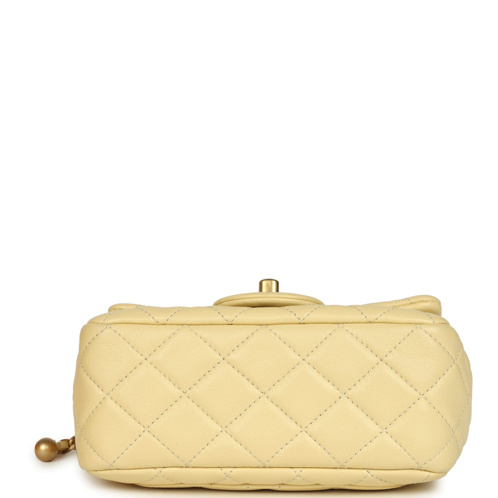 pre-owned-chanel-mini-pearl-crush-square-flap-bag-yellow-lambskin-brushed-gold-metal