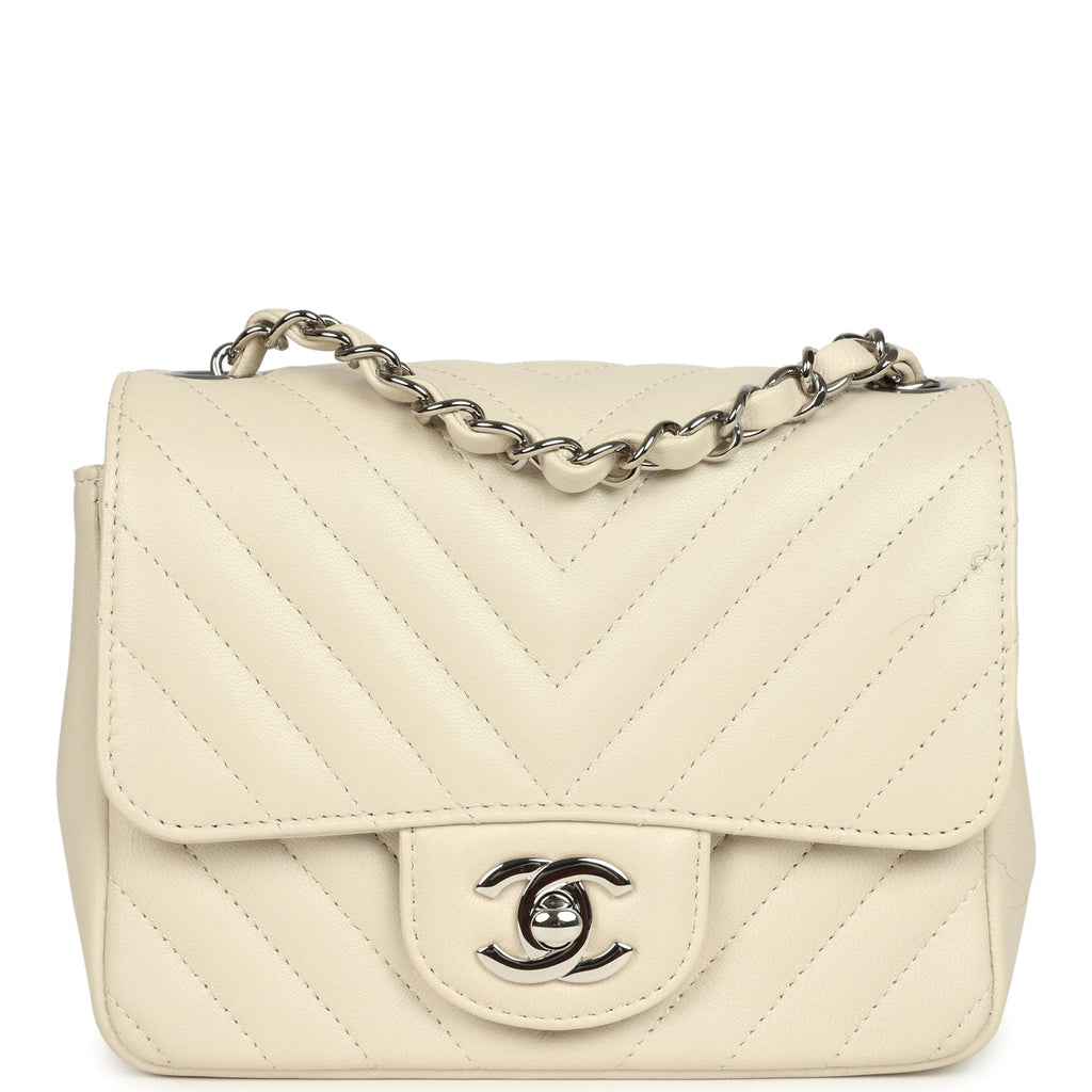 pre-owned-chanel-mini-chevron-square-flap-bag-ivory-lambskin-silver-metal
