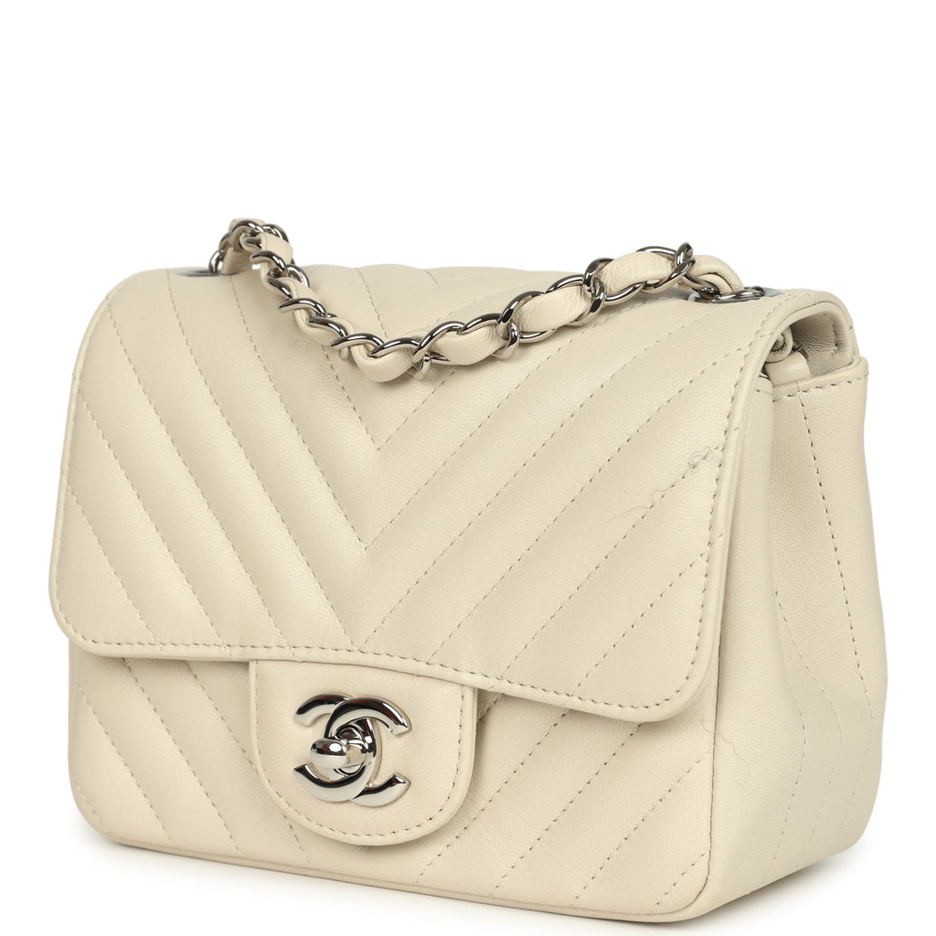 pre-owned-chanel-mini-chevron-square-flap-bag-ivory-lambskin-silver-metal
