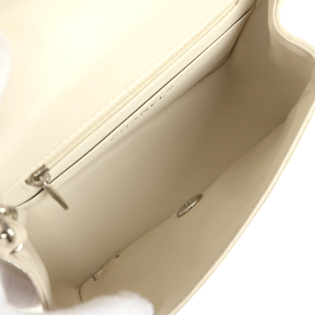 pre-owned-chanel-mini-chevron-square-flap-bag-ivory-lambskin-silver-metal