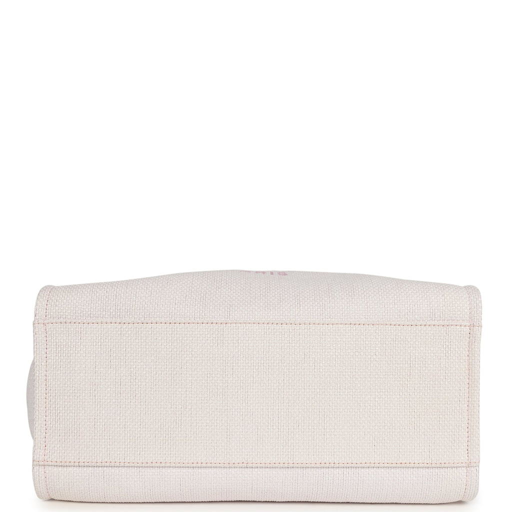 pre-owned-chanel-medium-deauville-shopping-tote-light-pink-raffia-and-canvas-silver-metal