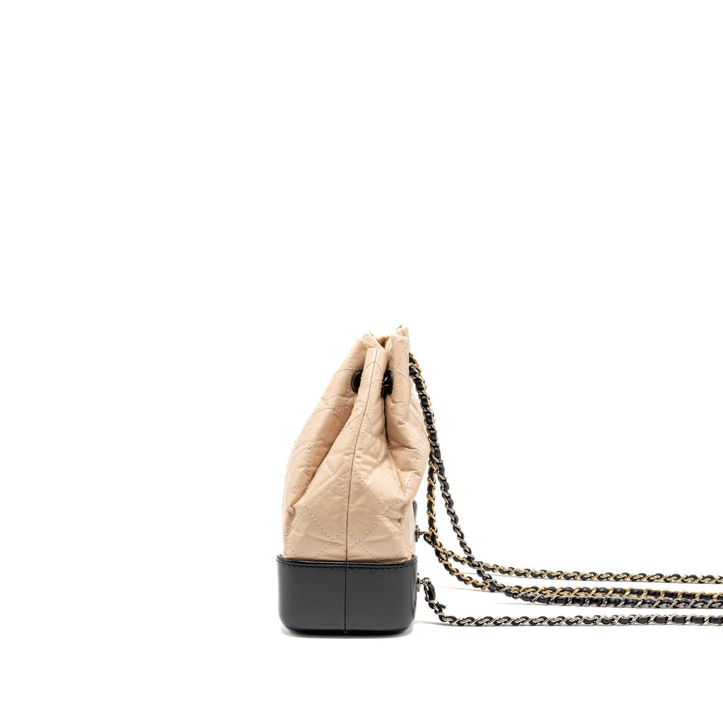 chanel-small-gabrielle-backpack-aged-calfskin-beige-black-multicolour-hardware-1
