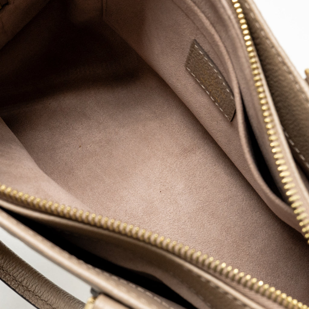 louis-vuitton-onthego-east-west-monogram-empreinte-leather-dove-cream-ghw-copy
