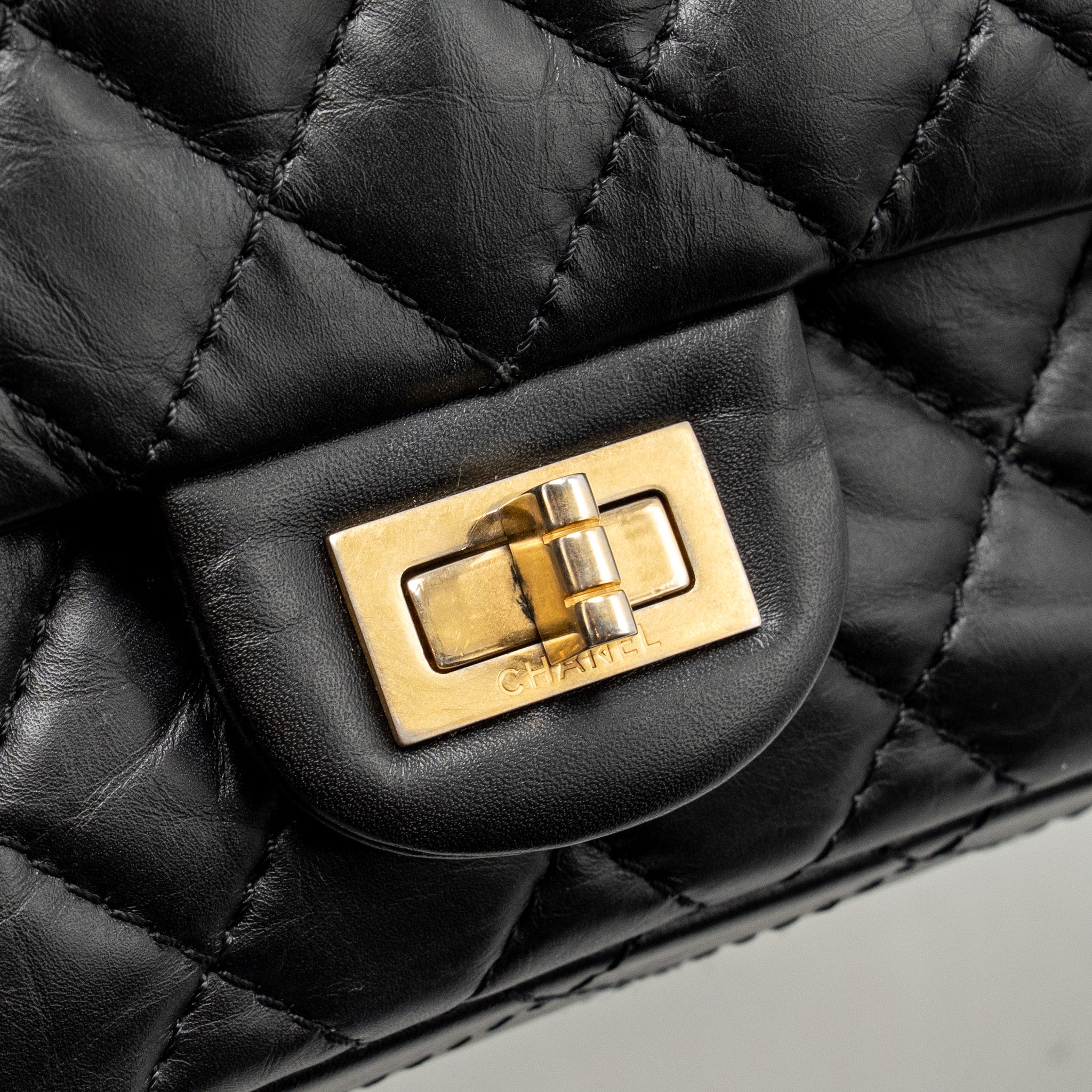 chanel-small-2-55-reissue-flap-bag-aged-calfskin-black-ghw-copy-1