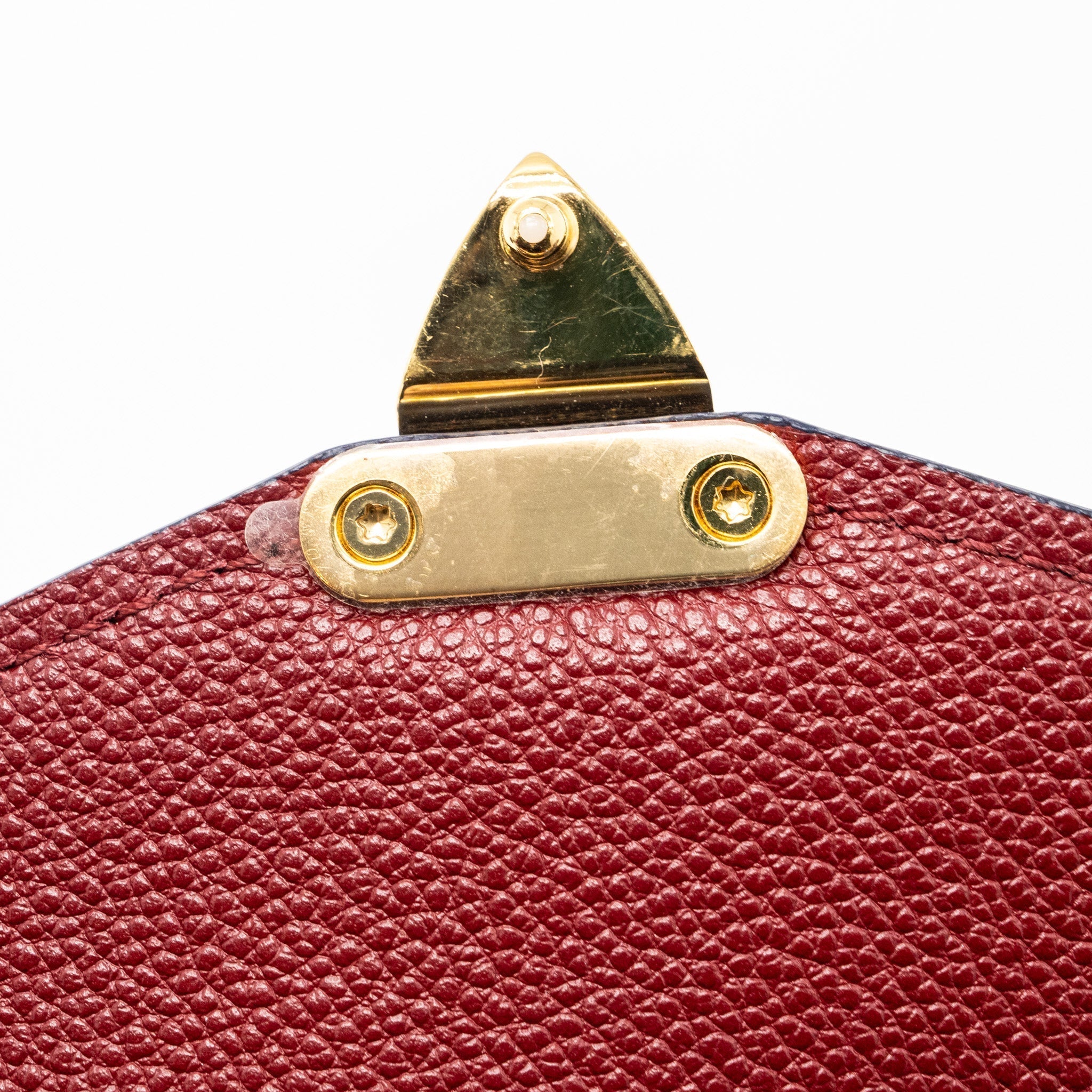 louis-vuitton-pochette-metis-monogram-empreinte-red-ghw