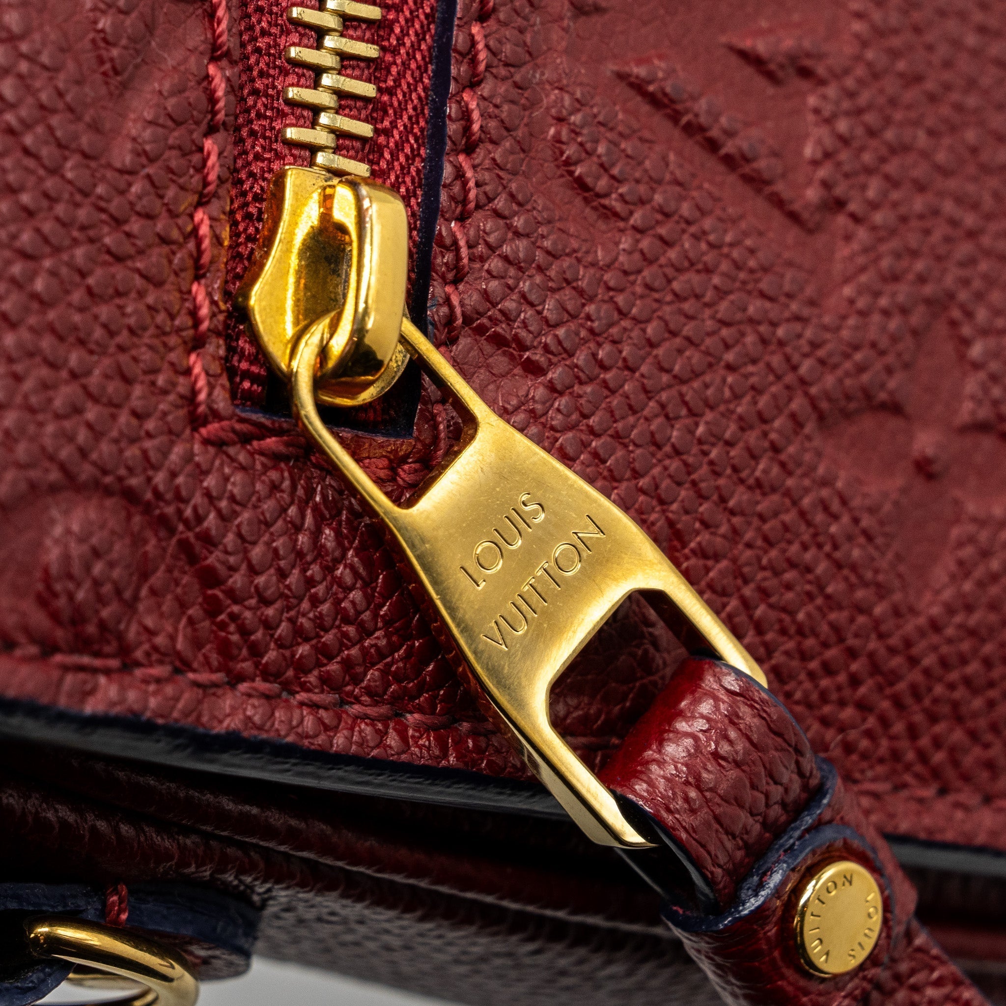 louis-vuitton-pochette-metis-monogram-empreinte-red-ghw