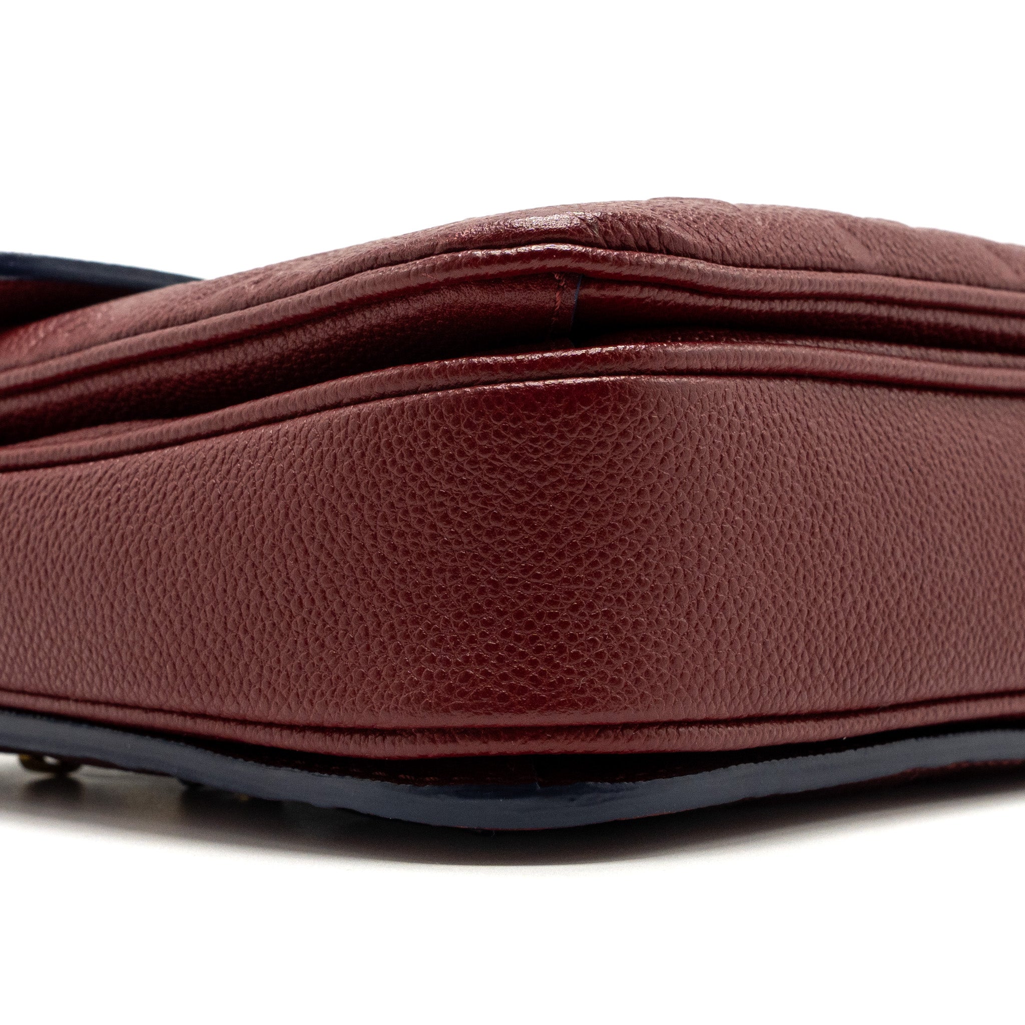 louis-vuitton-pochette-metis-monogram-empreinte-red-ghw