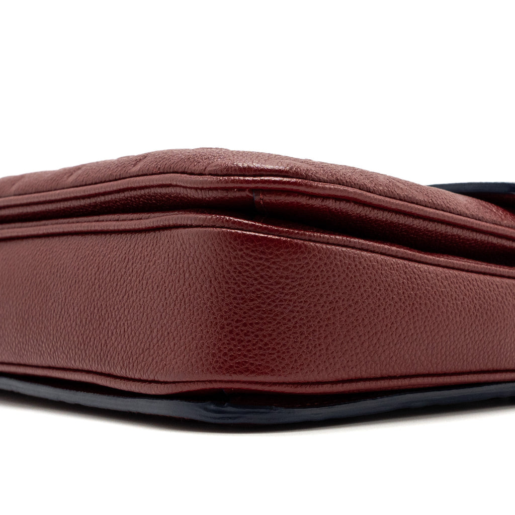 louis-vuitton-pochette-metis-monogram-empreinte-red-ghw