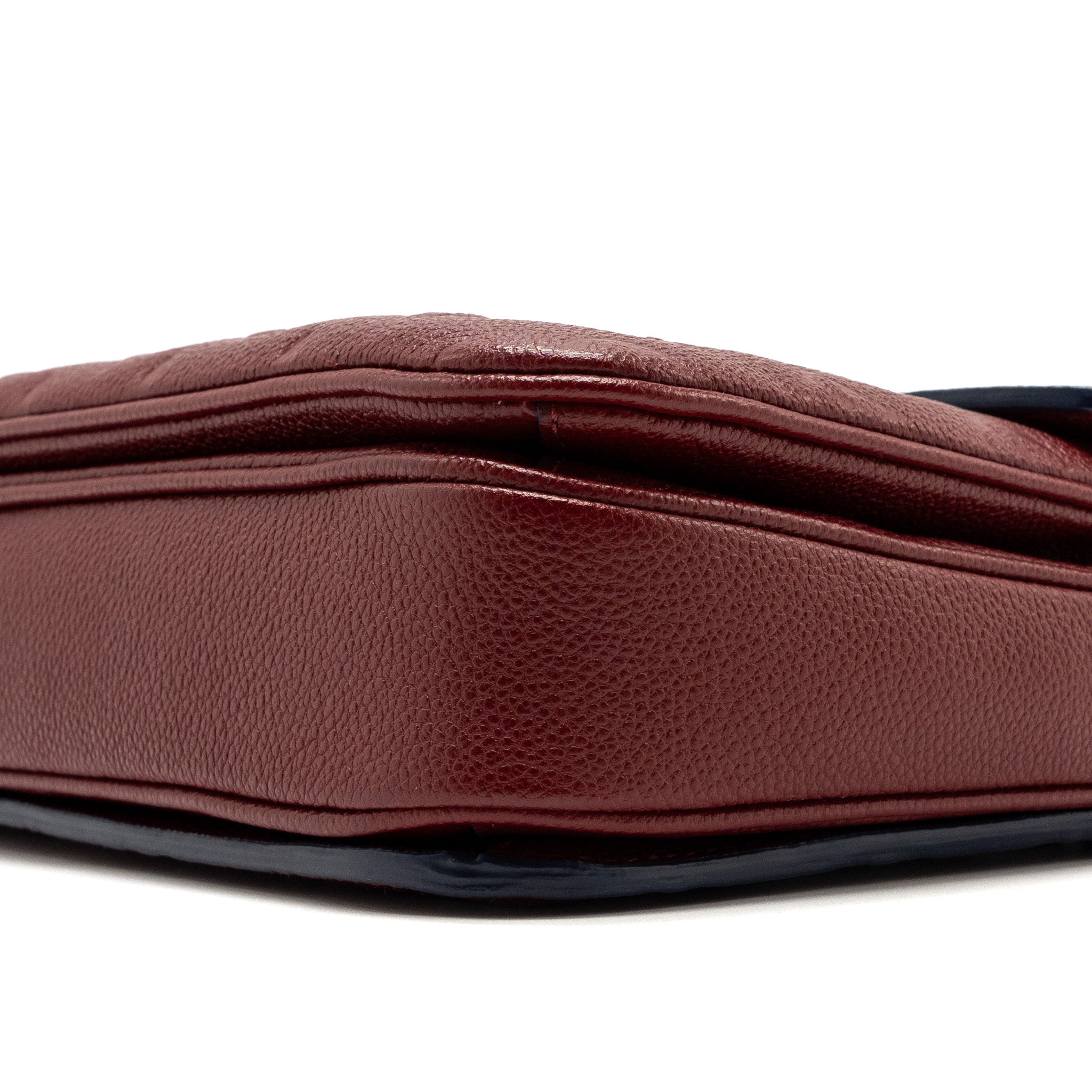 louis-vuitton-pochette-metis-monogram-empreinte-red-ghw