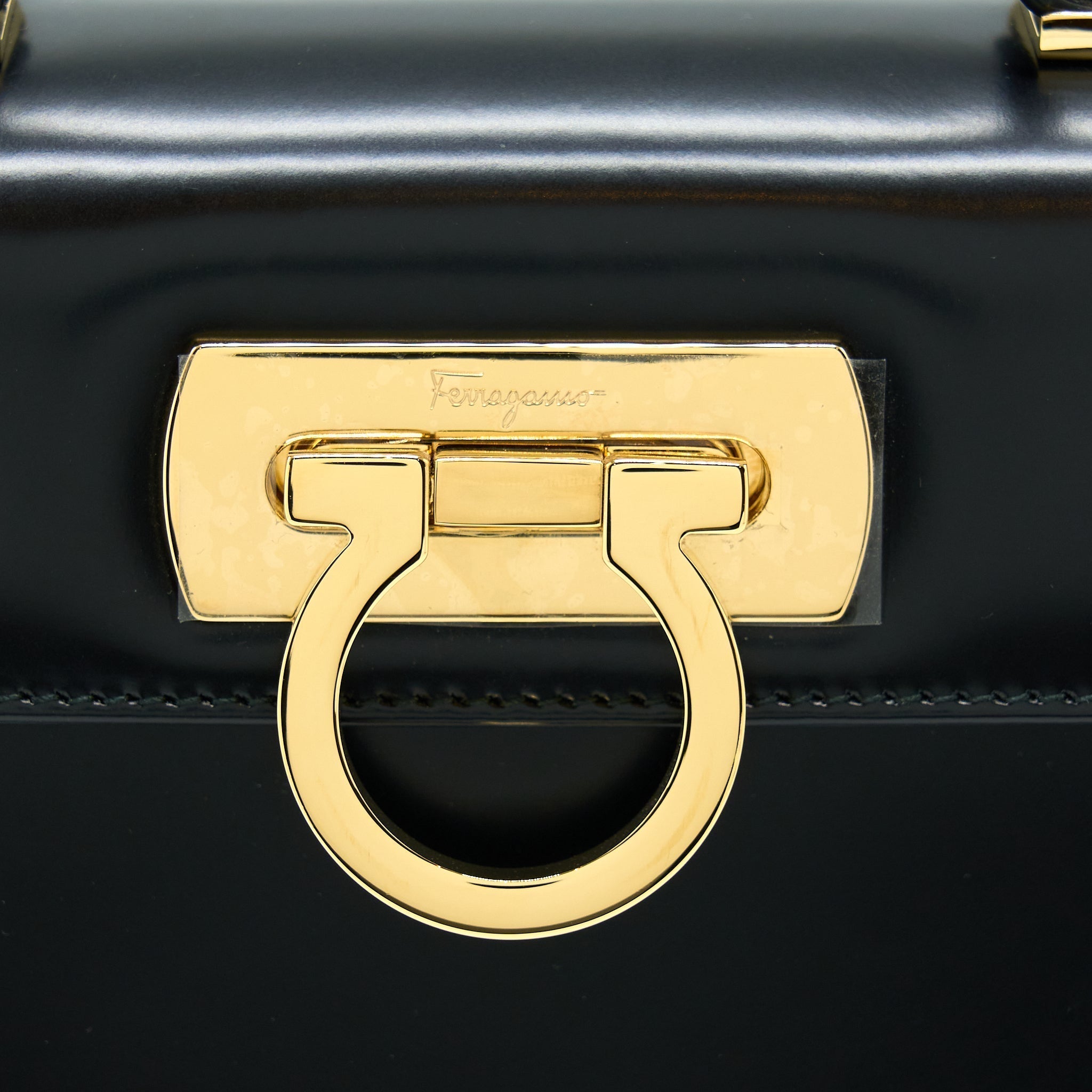 salvatore-ferragamo-gancini-top-handle-bag-calfskin-black-ghw