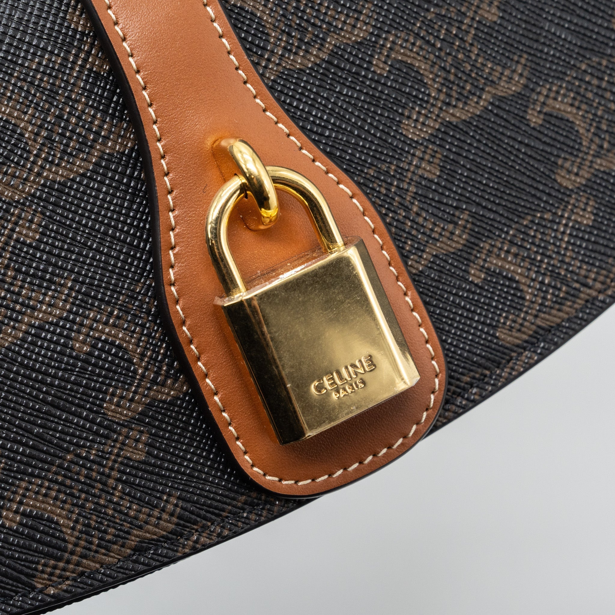celine-clutch-on-strap-tabou-triomphe-canvas-calfskin-ghw-tan