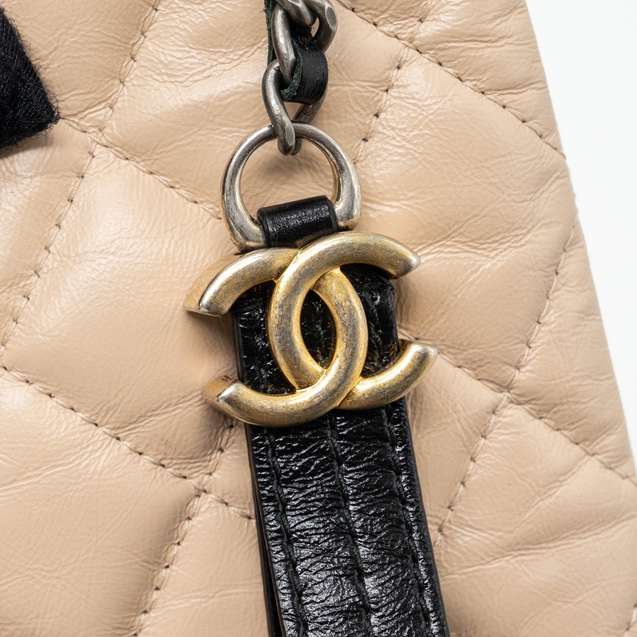 chanel-gabrielle-zip-clutch-bag-calfskin-beige-black-multicolor-hardware-copy