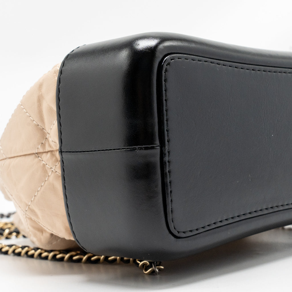 chanel-small-gabrielle-backpack-aged-calfskin-beige-black-multicolour-hardware-1