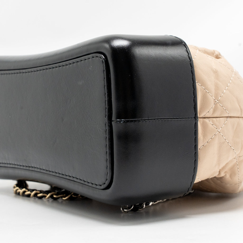 chanel-small-gabrielle-backpack-aged-calfskin-beige-black-multicolour-hardware-1