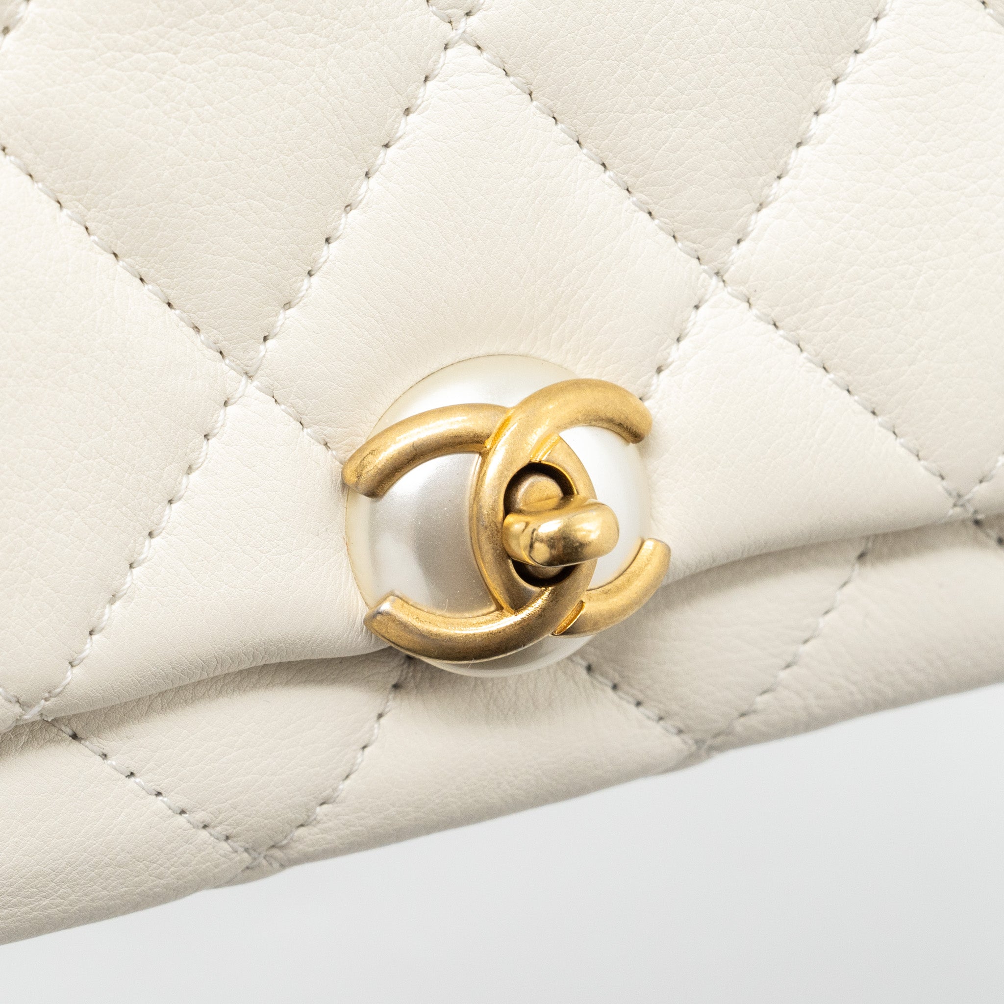 chanel-quilted-mini-flap-bag-lambskin-white-ghw