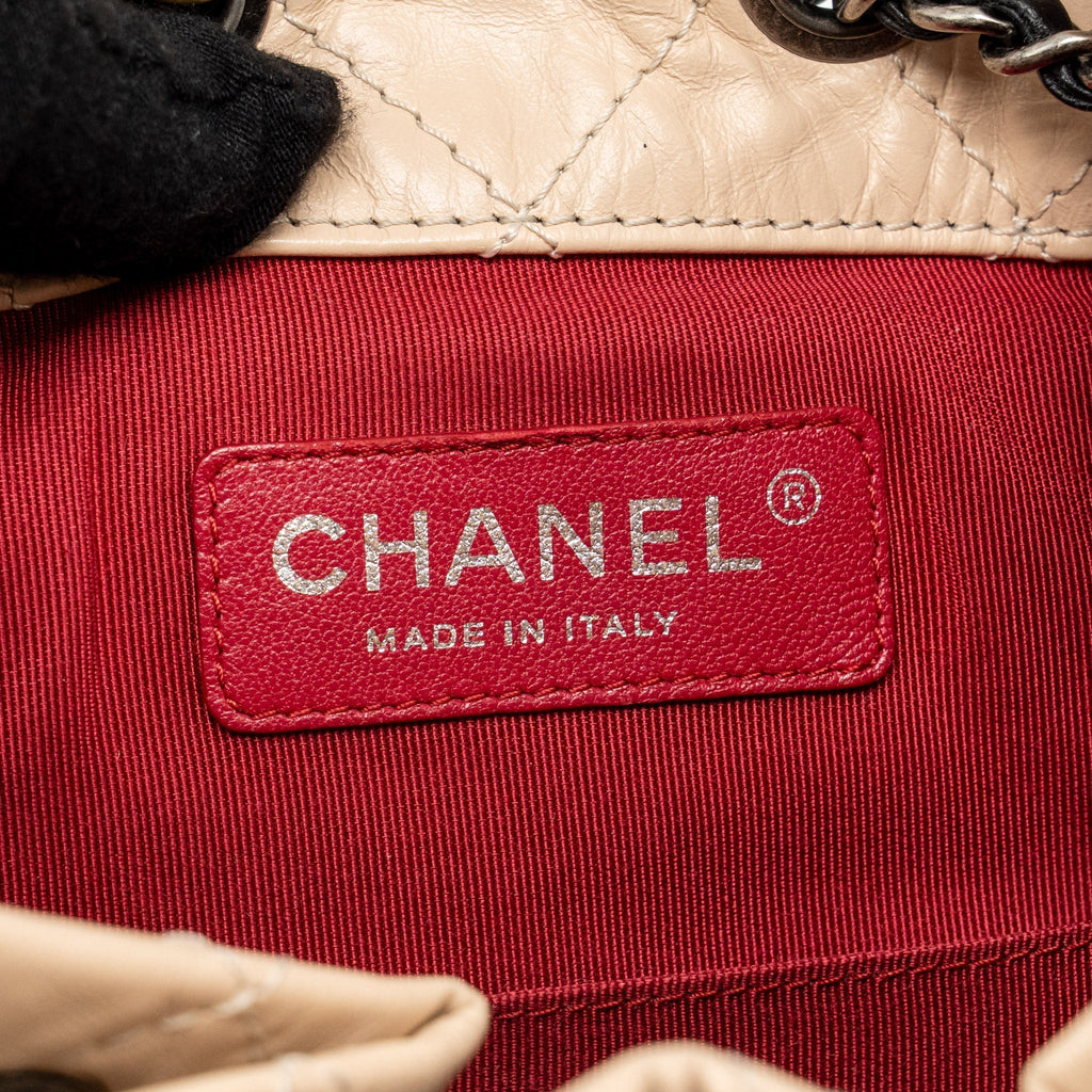 chanel-small-gabrielle-backpack-aged-calfskin-beige-black-multicolour-hardware-1