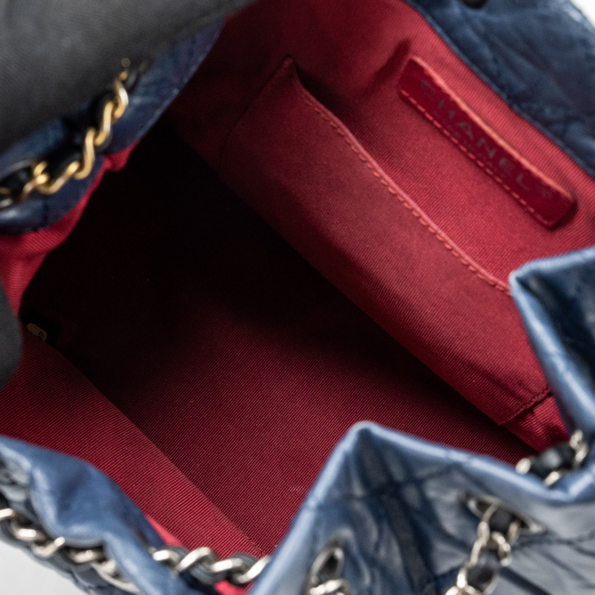 chanel-small-gabrielle-backpack-aged-calfskin-navy-blue-black-ruthenium-hardware