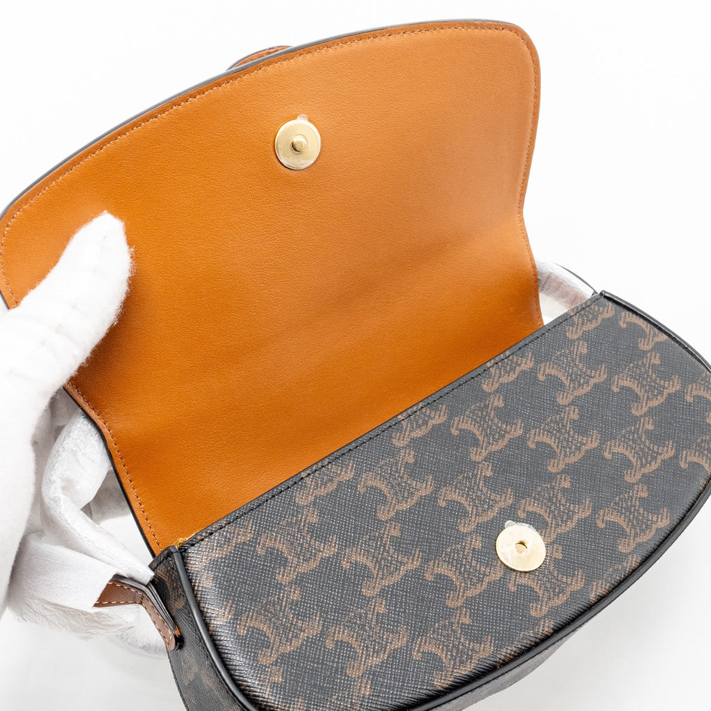 celine-clutch-on-strap-tabou-in-triomphe-canvas-calfskin-tan-ghw