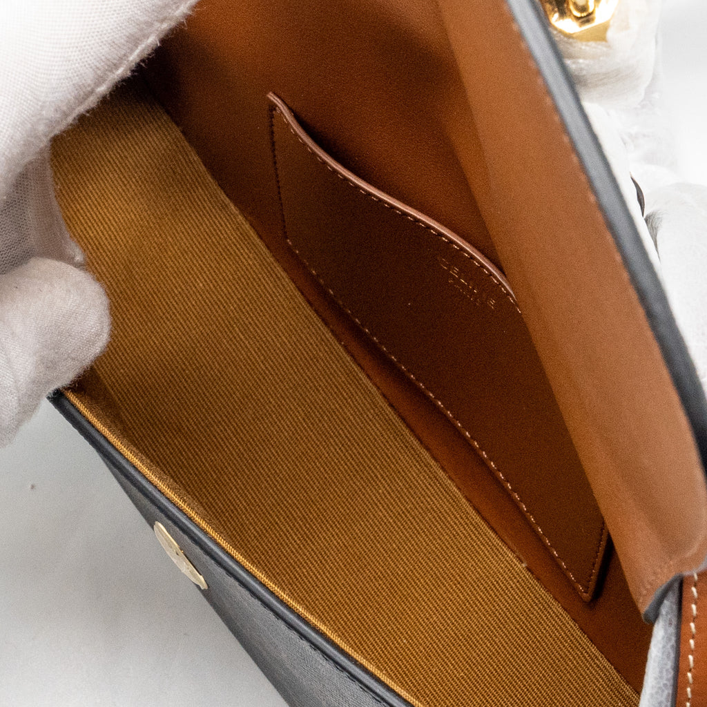 celine-clutch-on-strap-tabou-in-triomphe-canvas-calfskin-tan-ghw