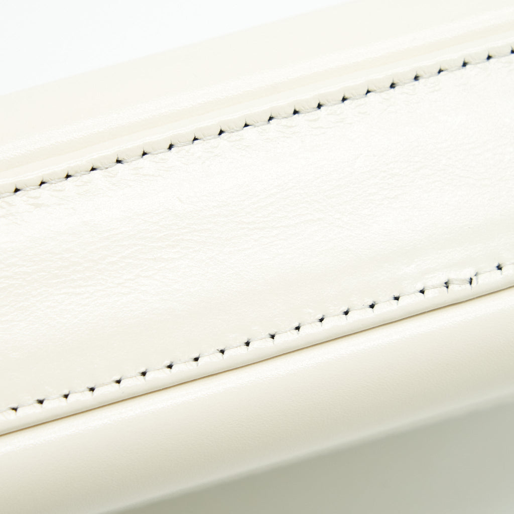 chanel-gabrielle-clutch-on-chain-aged-calfskin-white-with-silver-and-gold-hardware