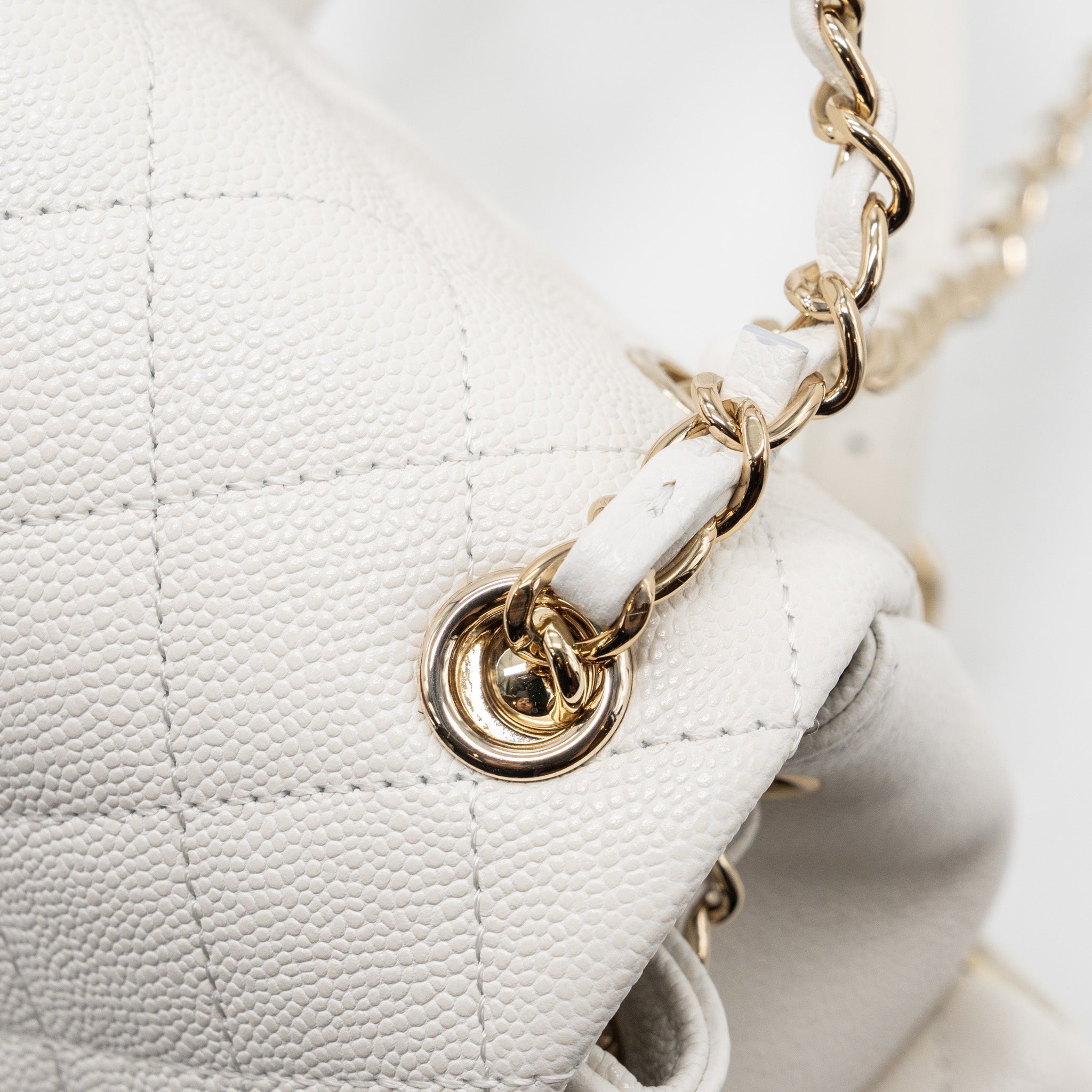 copy-of-chanel-23k-triple-pocket-mini-backpack-caviar-white-lghwmicrochip