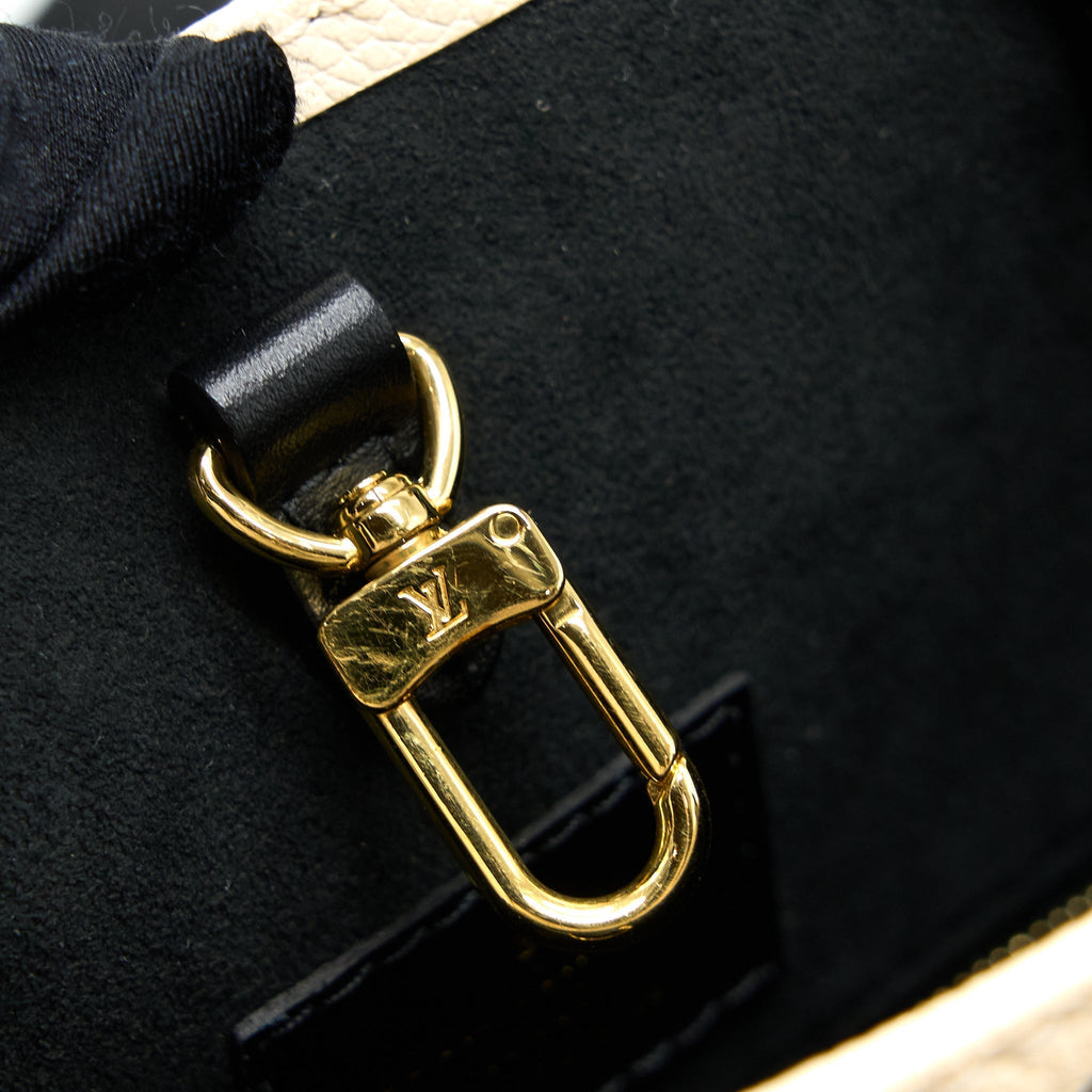 louis-vuitton-onthego-mm-empreinte-cream-black-ghw-new-version