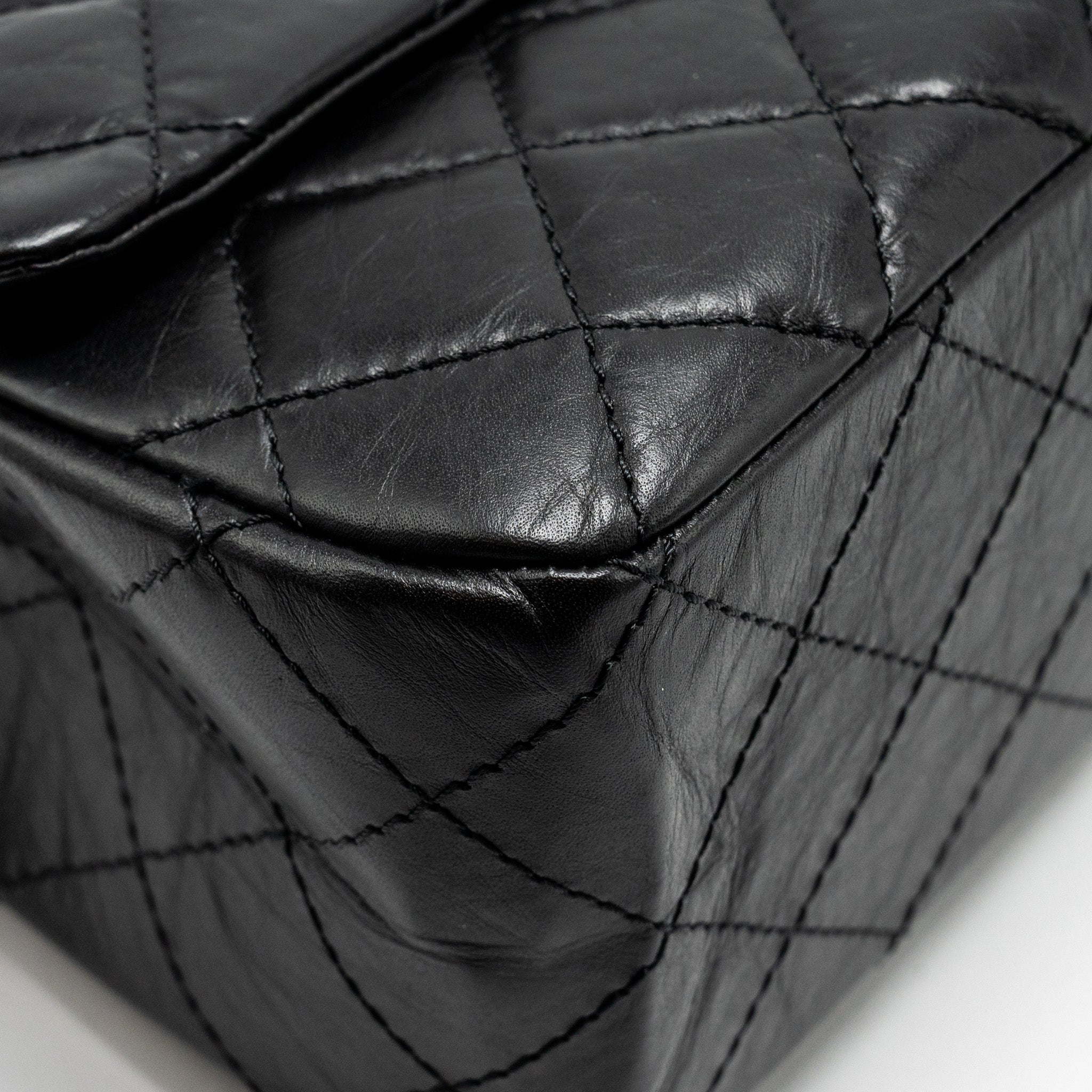 chanel-maxi-2-55-reissue-flap-bag-aged-calfskin-black-ghw-1