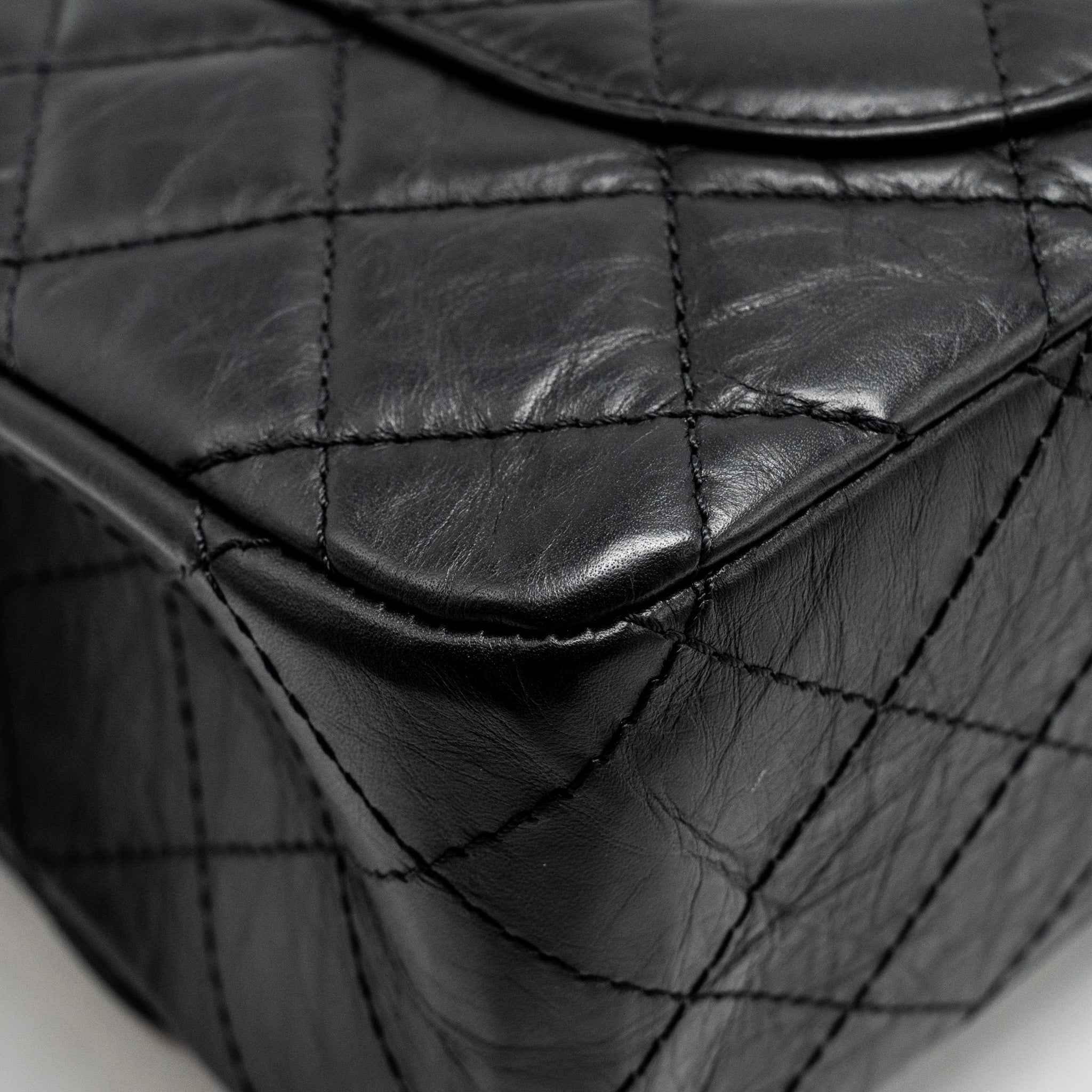 chanel-maxi-2-55-reissue-flap-bag-aged-calfskin-black-ghw-1