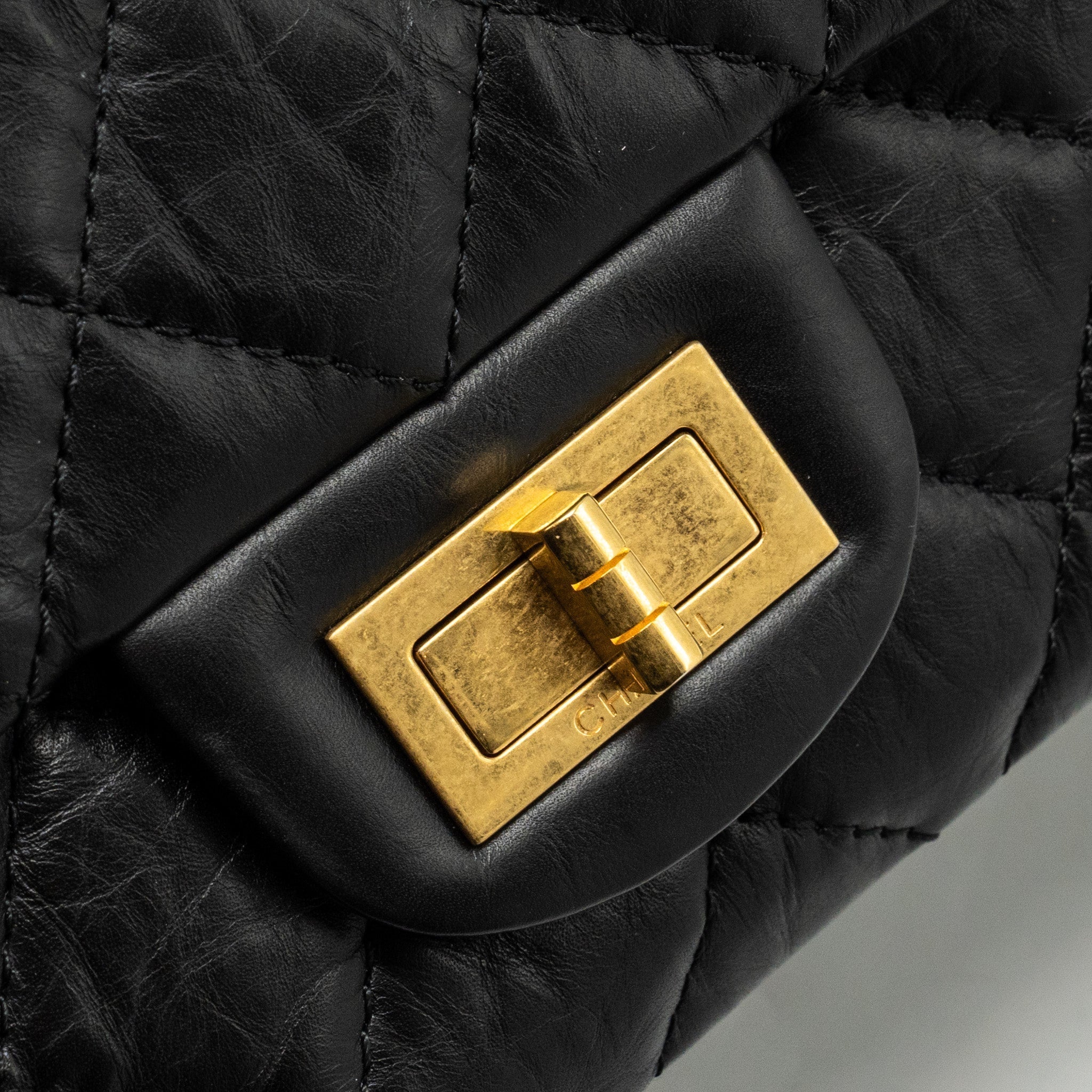 chanel-maxi-2-55-reissue-flap-bag-aged-calfskin-black-ghw-1