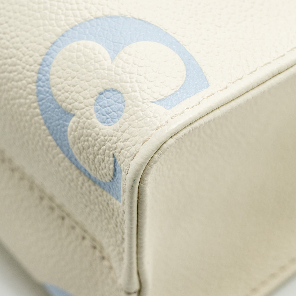 louis-vuitton-onthego-pm-bicolour-monogram-empreinte-latte-candy-blue