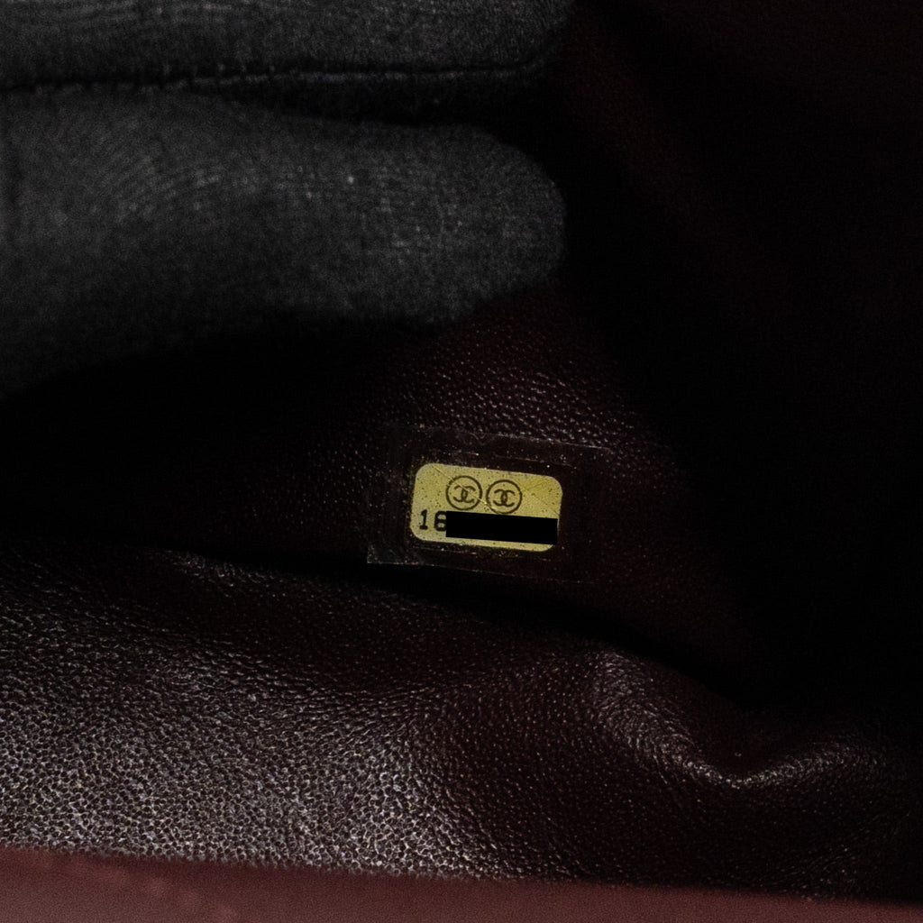 chanel-maxi-2-55-reissue-flap-bag-aged-calfskin-black-ghw-1