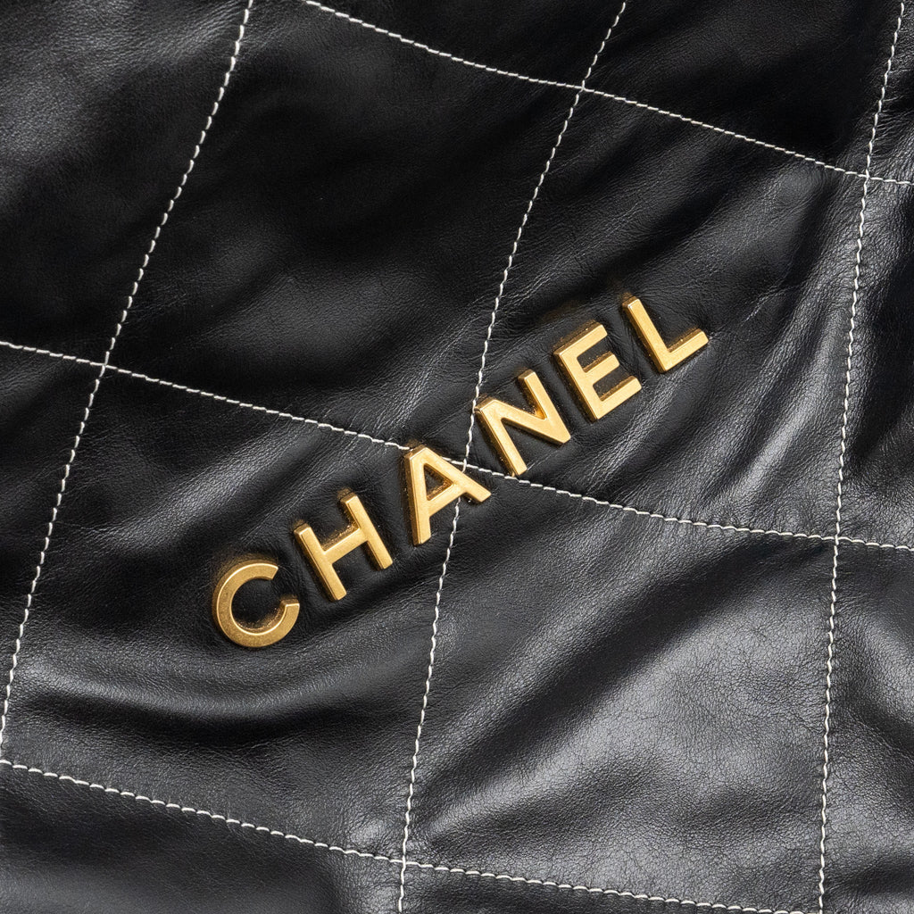 chanel-medium-22-bag-shiny-calfskin-black-with-white-stitching-gold-letter-ghw