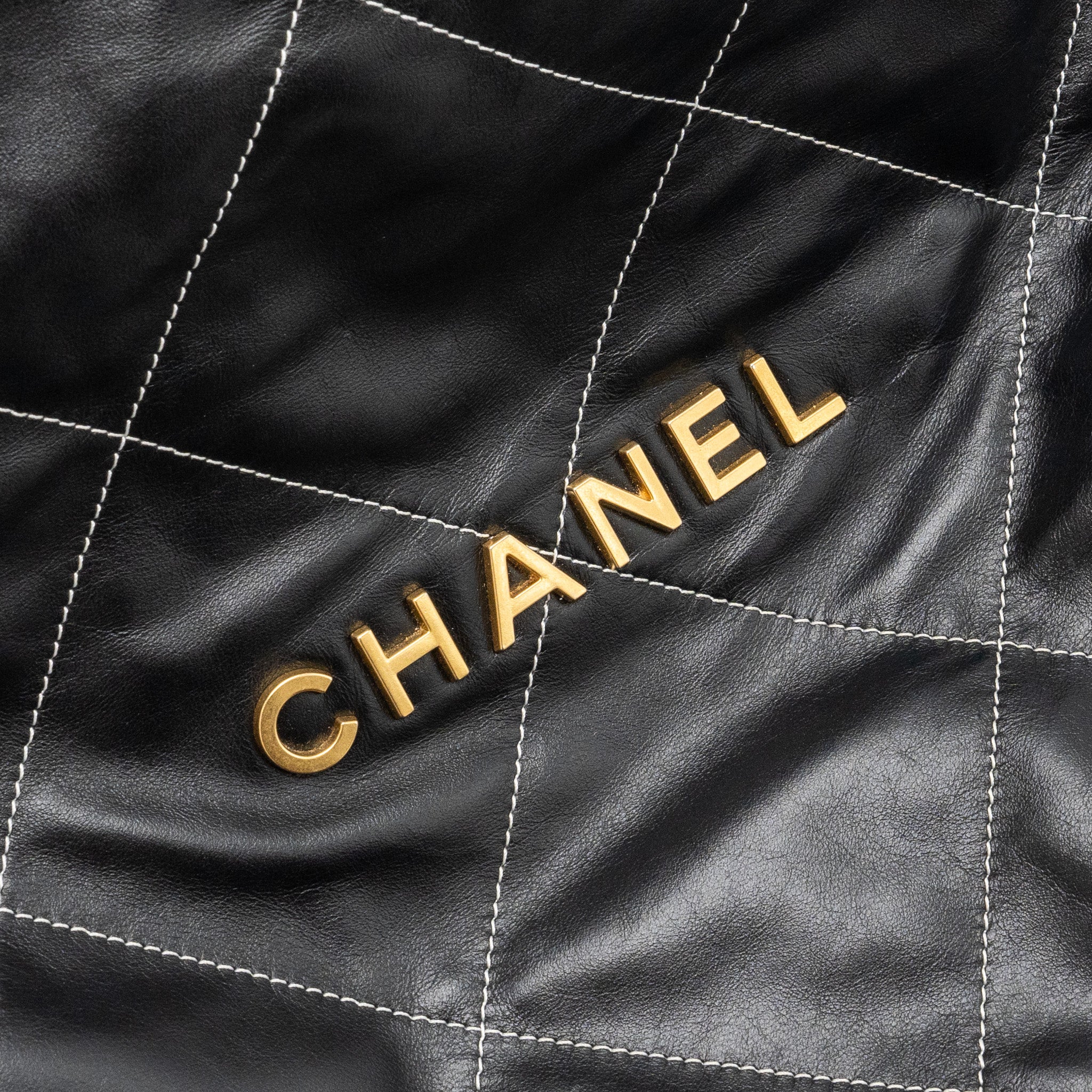 chanel-medium-22-bag-shiny-calfskin-black-with-white-stitching-gold-letter-ghw