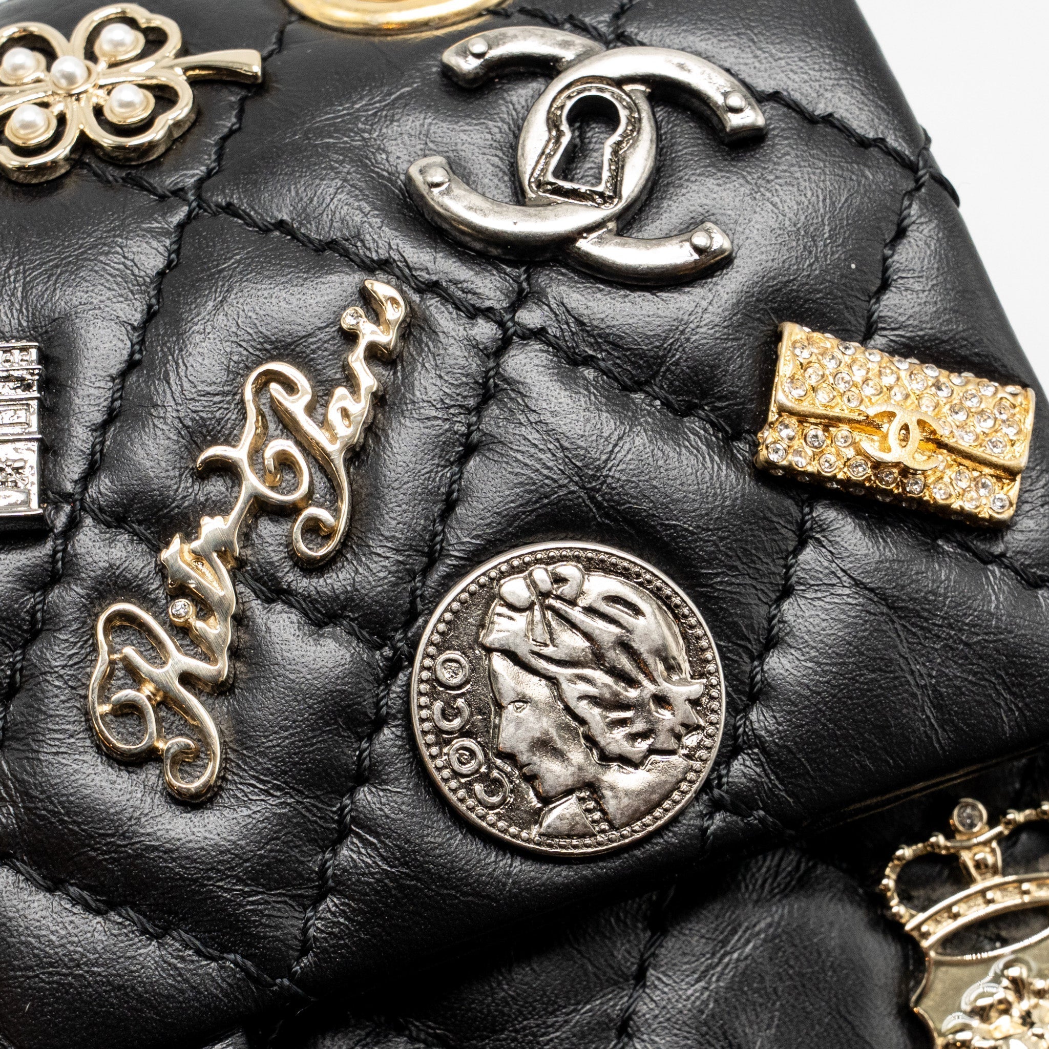 chanel-mini-2-55-reissue-flap-bag-lucky-charms-aged-calfskin-black-ghw