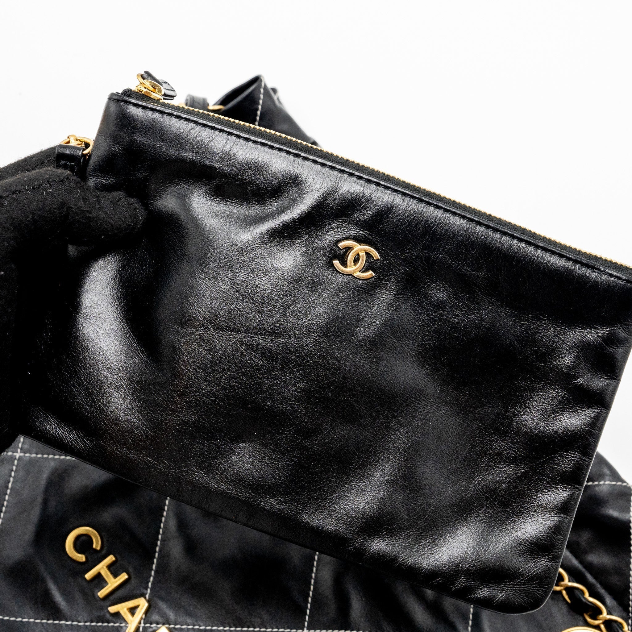 chanel-medium-22-bag-shiny-calfskin-black-with-white-stitching-gold-letter-ghw