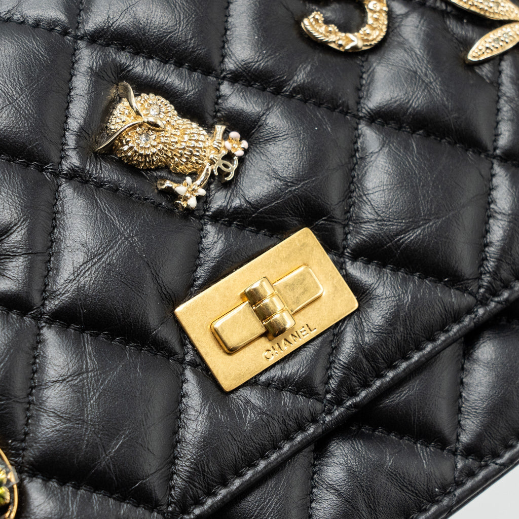 chanel-2-55-reissue-lucky-charms-wallet-on-chain-aged-calfskin-black-ghw