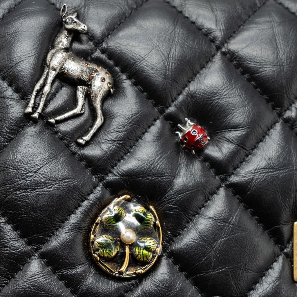chanel-2-55-reissue-lucky-charms-wallet-on-chain-aged-calfskin-black-ghw