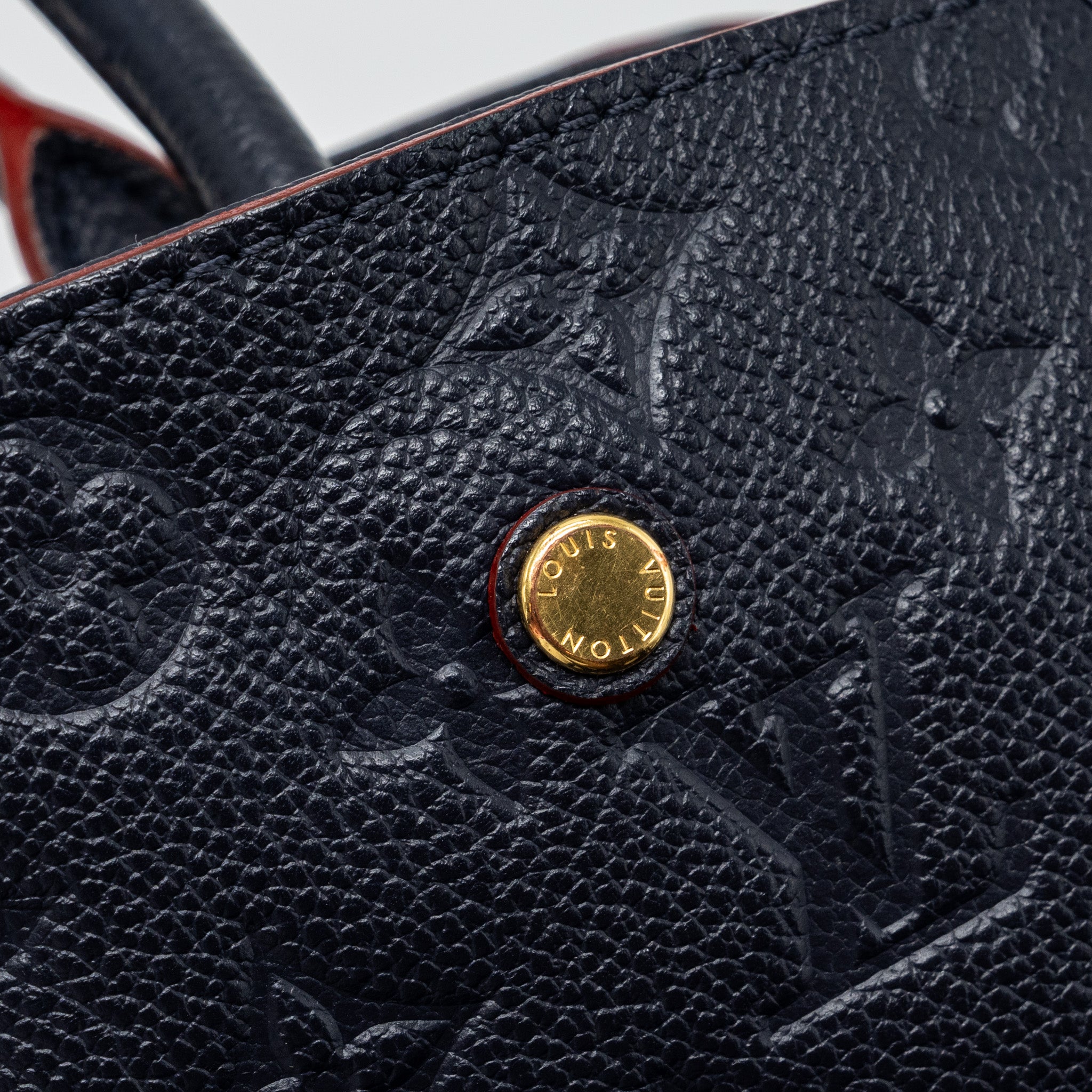 louis-vuitton-montaigne-mm-monogram-empreinte-navy-ghw
