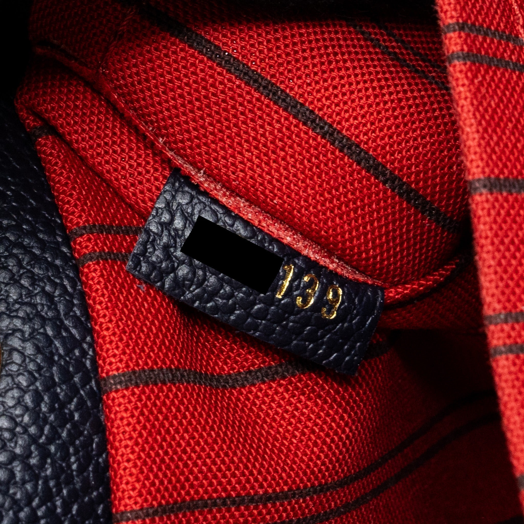 louis-vuitton-montaigne-mm-monogram-empreinte-navy-ghw
