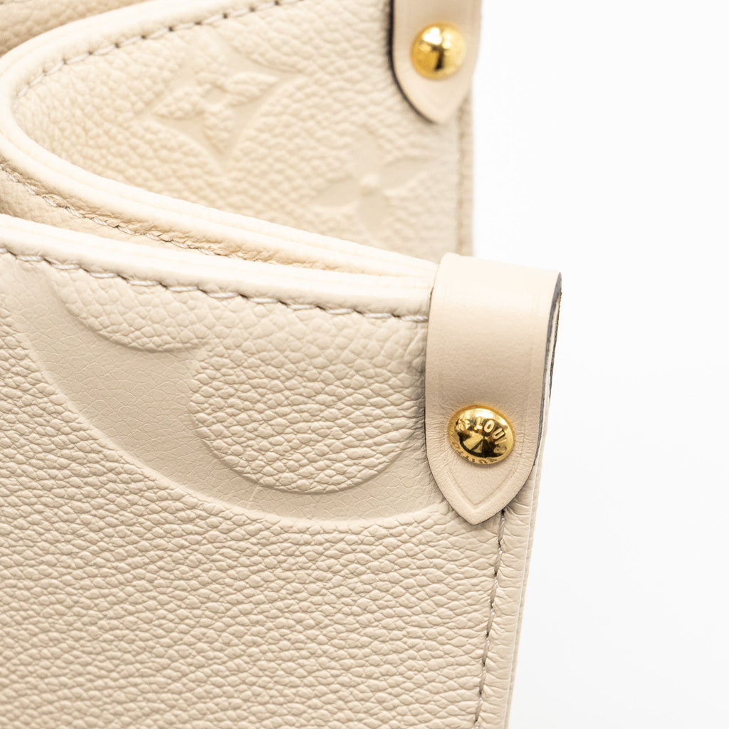 louis-vuitton-onthego-mm-empreinte-leather-white-ghw-new-version