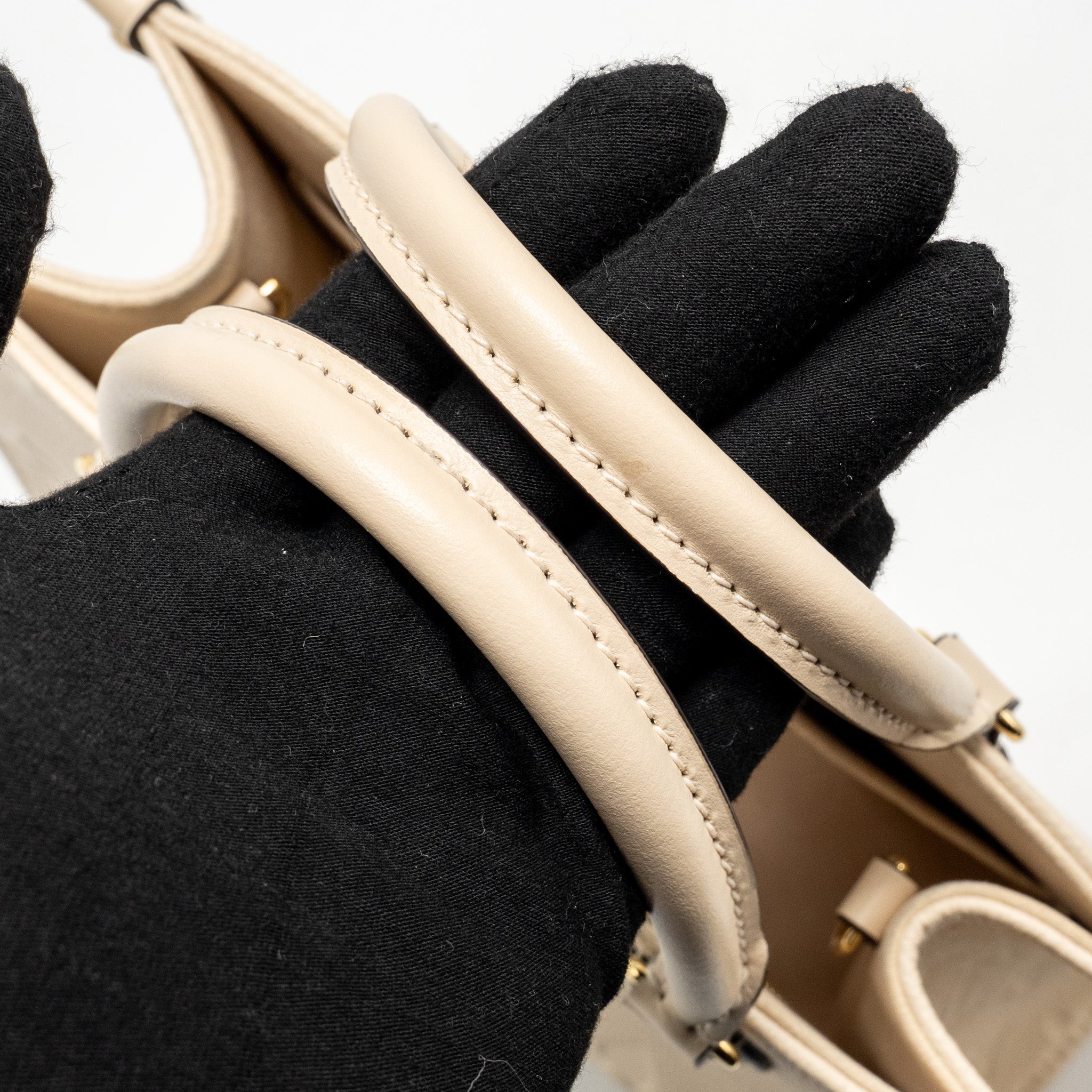 louis-vuitton-onthego-pm-monogram-empreinte-leather-creme-ghw