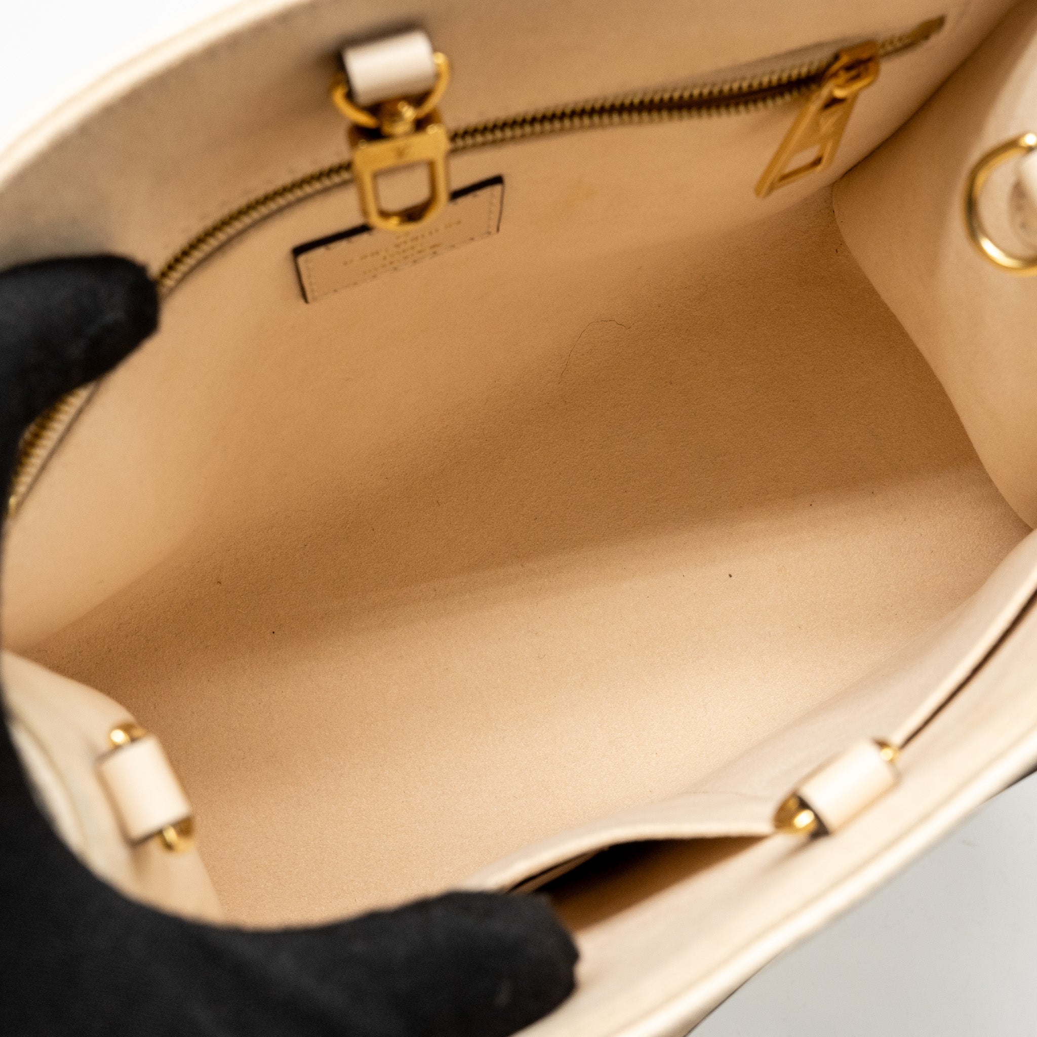 louis-vuitton-onthego-pm-monogram-empreinte-leather-creme-ghw