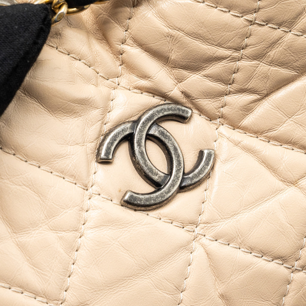 chanel-small-gabrielle-backpack-aged-calfskin-beige-black-multicolour-hardware