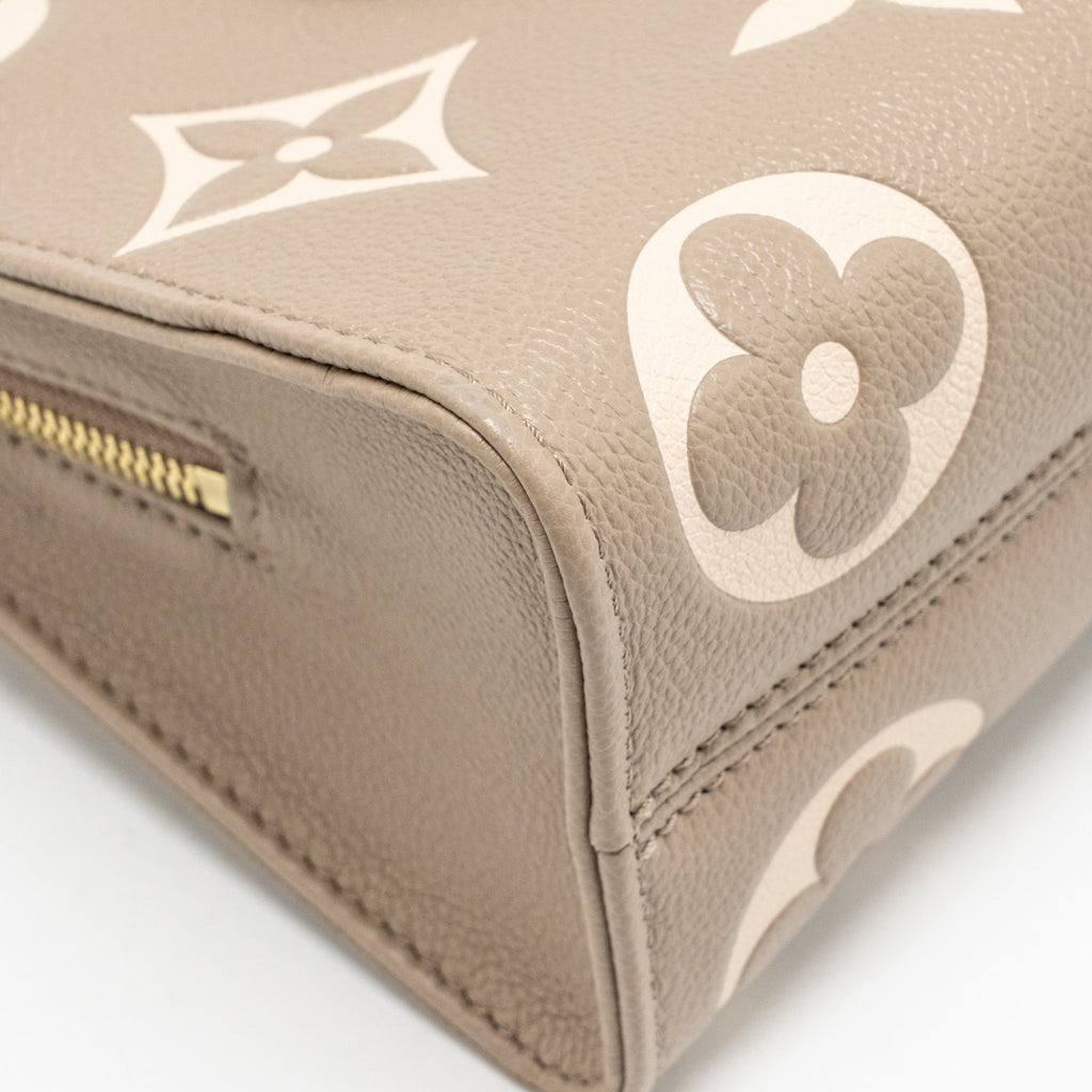 louis-vuitton-onthego-east-west-monogram-empreinte-leather-dove-cream-ghw-copy