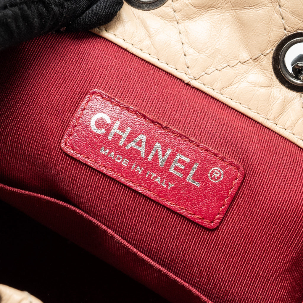 chanel-small-gabrielle-backpack-aged-calfskin-beige-black-multicolour-hardware