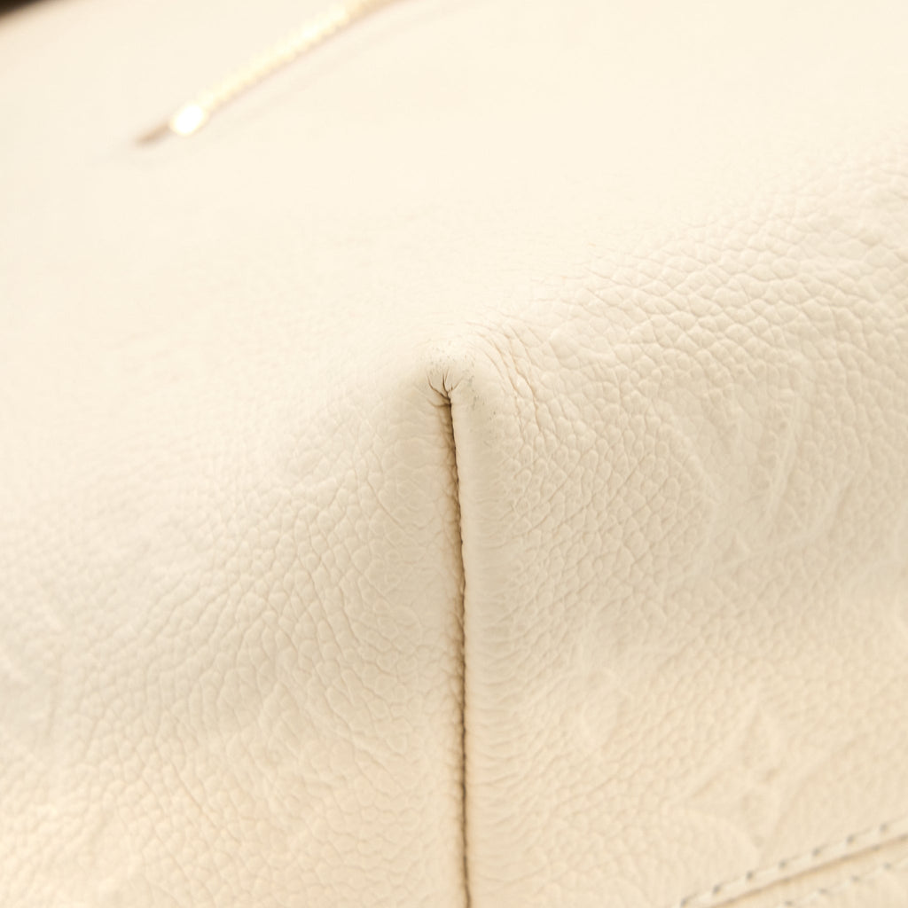 louis-vuitton-montsouris-monogram-empreinte-cream-ghw