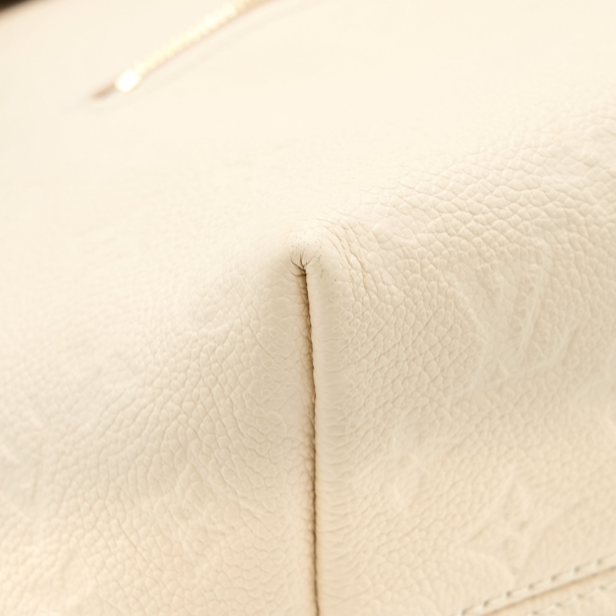 louis-vuitton-montsouris-monogram-empreinte-cream-ghw