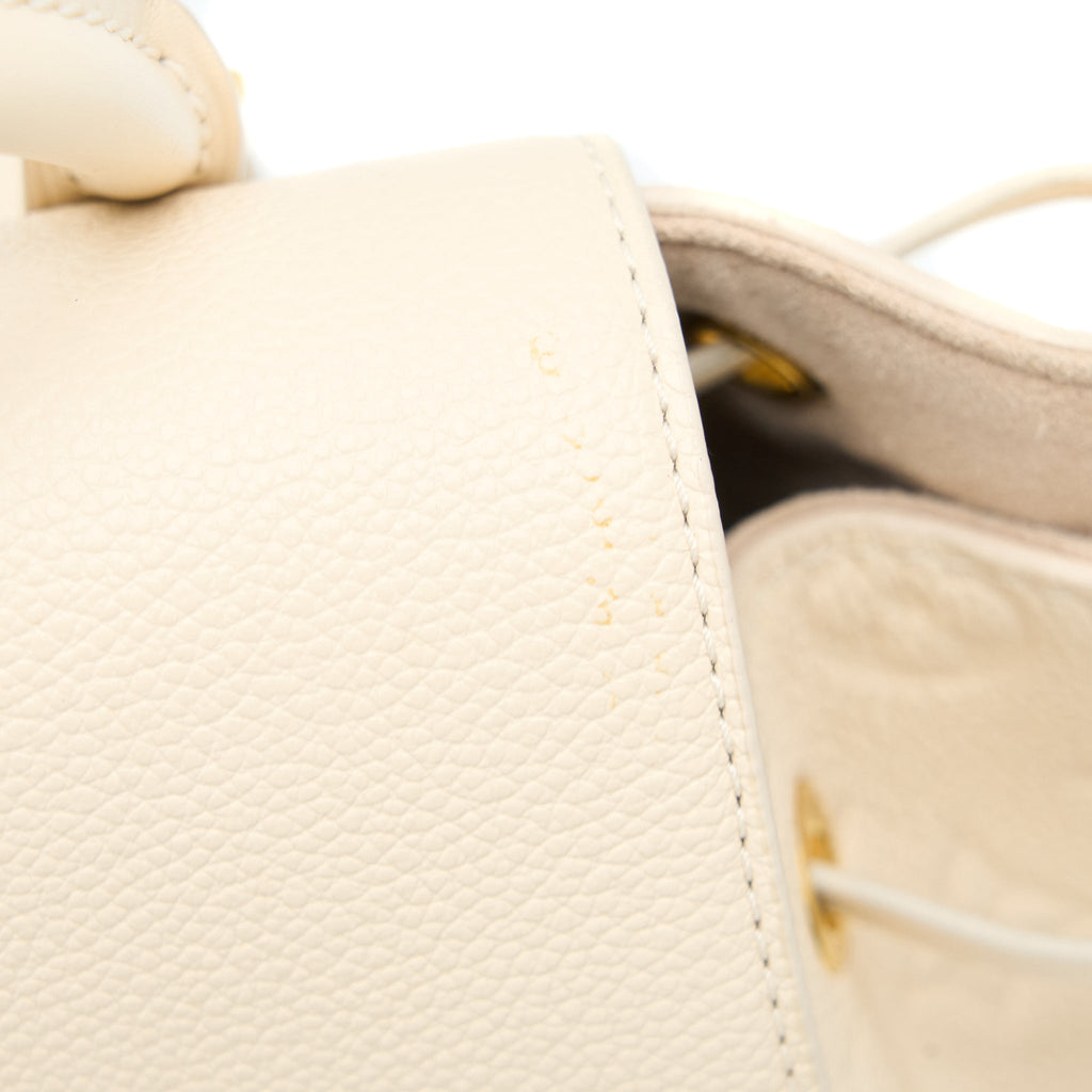 louis-vuitton-montsouris-monogram-empreinte-cream-ghw